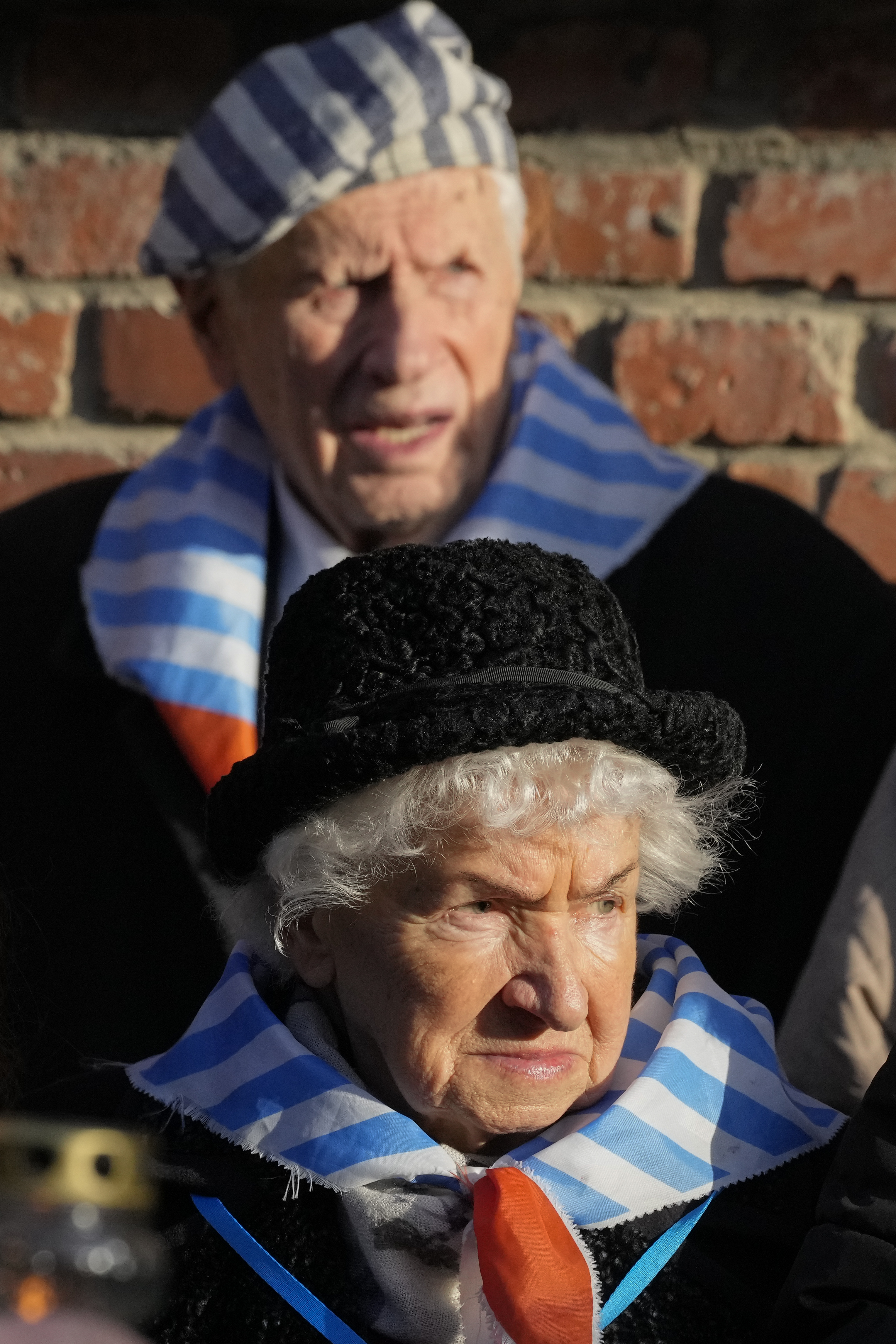 Survivors and relatives attend a ceremony at the Auschwitz-Birkenau former Nazi German concentration and extermination camp, in Oswiecim, Poland, Monday, Jan. 27, 2025.<br />(Czarek Sokolowski / AP Photo)