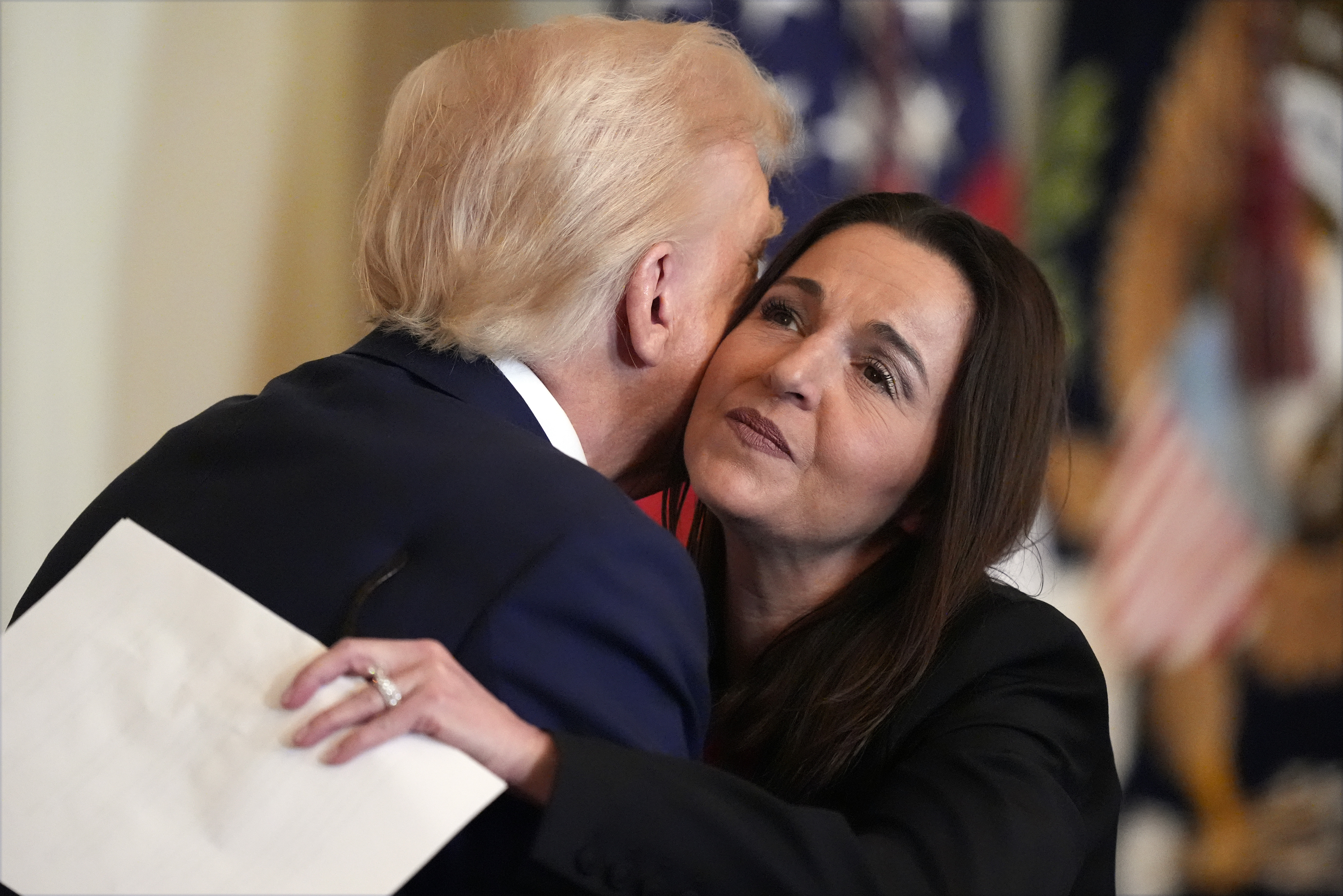 President Donald Trump hugs Allyson Phillips, mother of Laken Riley, before he signs the Laken Riley Act in the East Room of the White House, Wednesday, Jan. 29, 2025, in Washington.<br />(Alex Brandon / AP Photo)