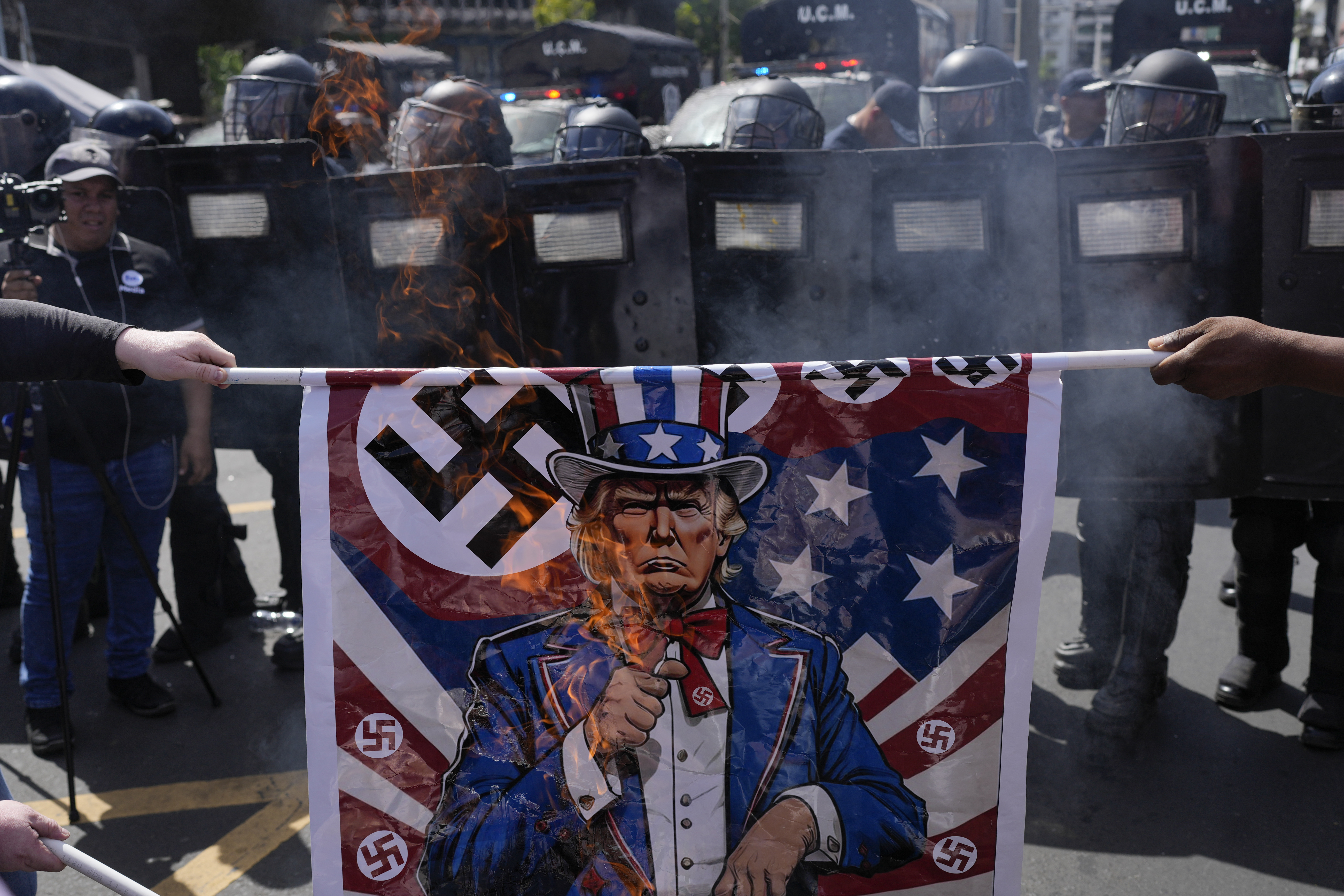 Protesters burn posters depicting President Donald Trump during a rally against U.S. Secretary of State Marco Rubio&#039;s visit in Panama City, Sunday, Feb. 2, 2025.<br />(Matias Delacroix / AP Photo)