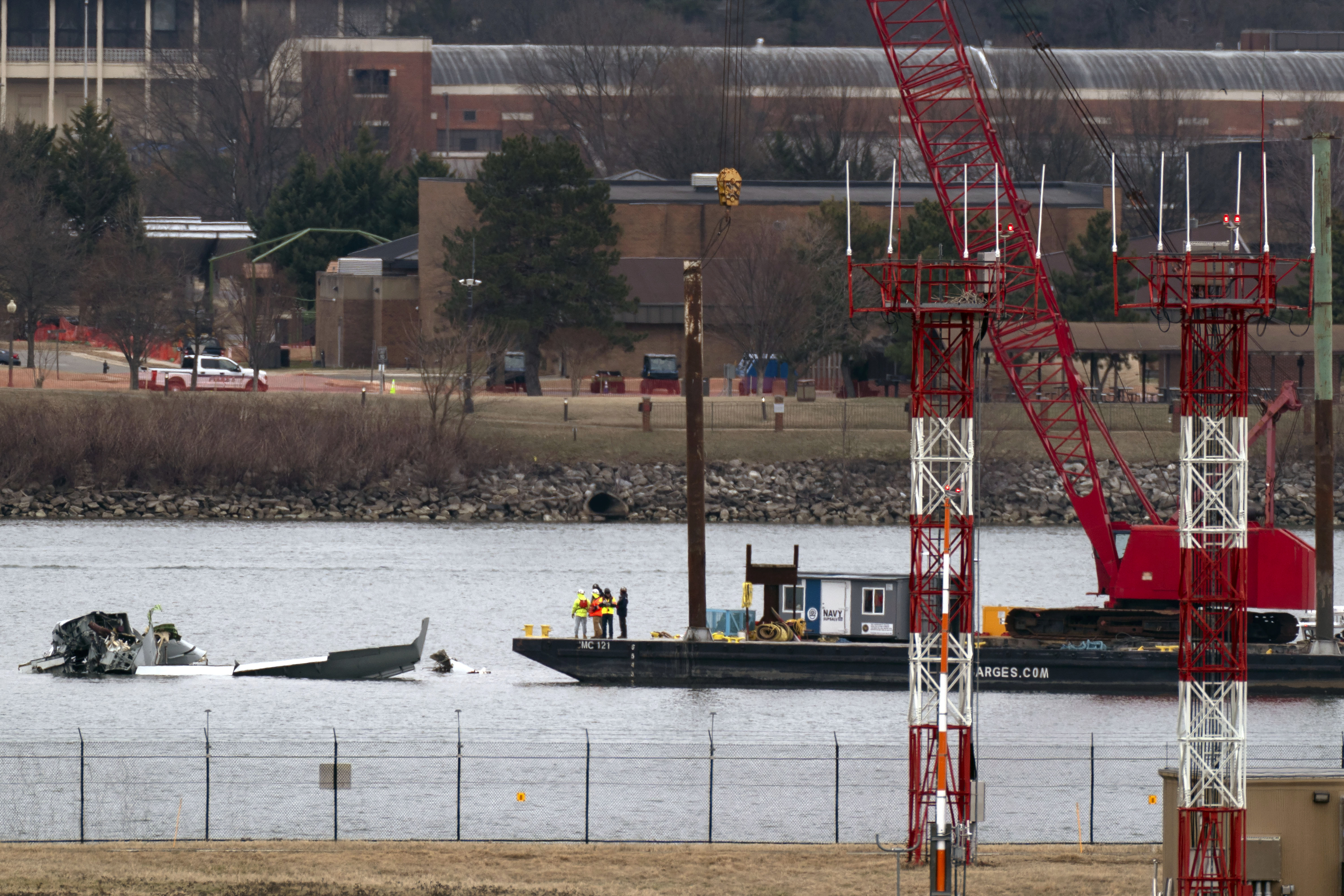 Rescue and salvage crews with cranes work near the wreckage of an American Airlines jet in the Potomac River from Ronald Reagan Washington National Airport, Sunday, Feb. 2, 2025, in Arlington, Va.<br />(Jose Luis Magana / AP Photo)