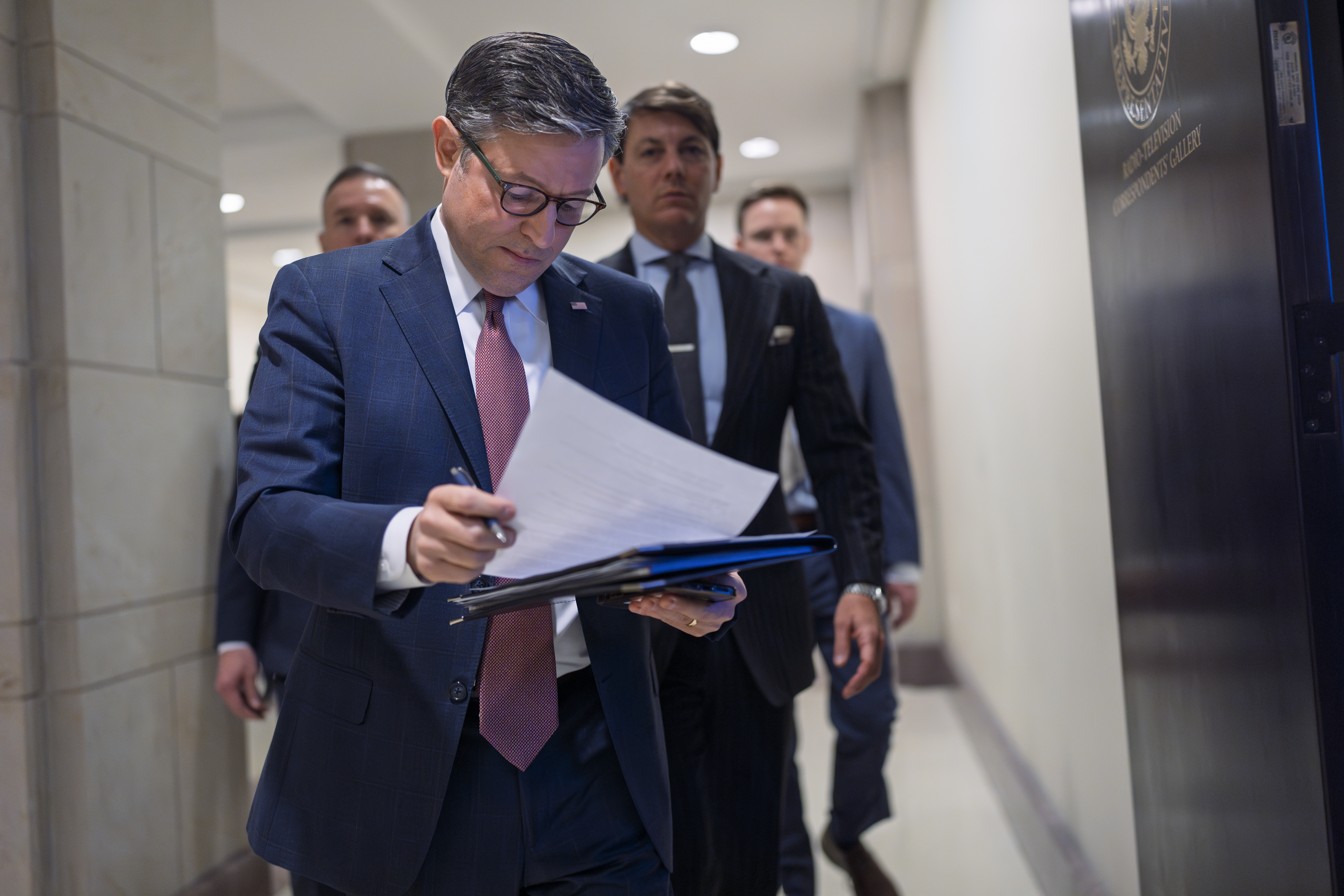Speaker of the House Mike Johnson, R-La., arrives to talk to reporters after a closed-door meeting with fellow Republicans to find agreement on a spending bill, at the Capitol in Washington, Tuesday, Feb. 11, 2025.<br />(J. Scott Applewhite / AP Photo)