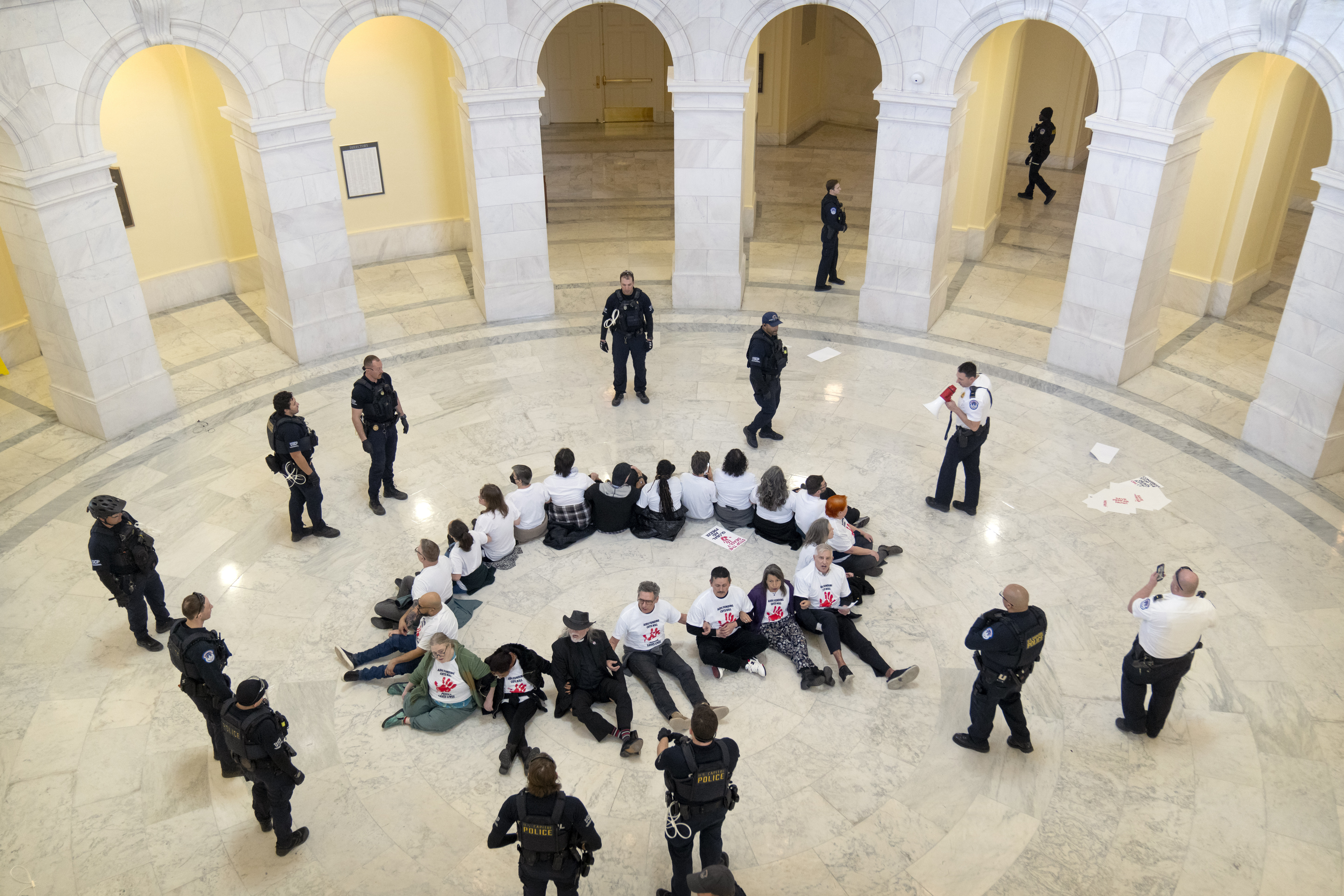 U.S. Capitol Police surround demonstrators as they protest against cuts to American foreign aid spending on Wednesday, Feb. 26, 2025, in Washington.<br />(Mark Schiefelbein / AP Photo)