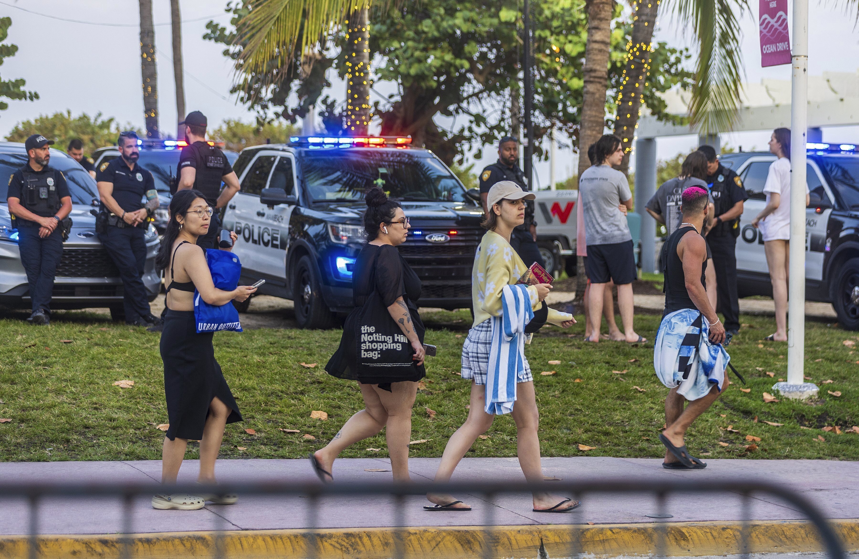 City of Miami Beach police officers are staged along Ocean Drive during spring break on South Beach, in Miami Beach, Fla., March 9, 2024.<br />(Pedro Portal / Miami Herald via AP)
