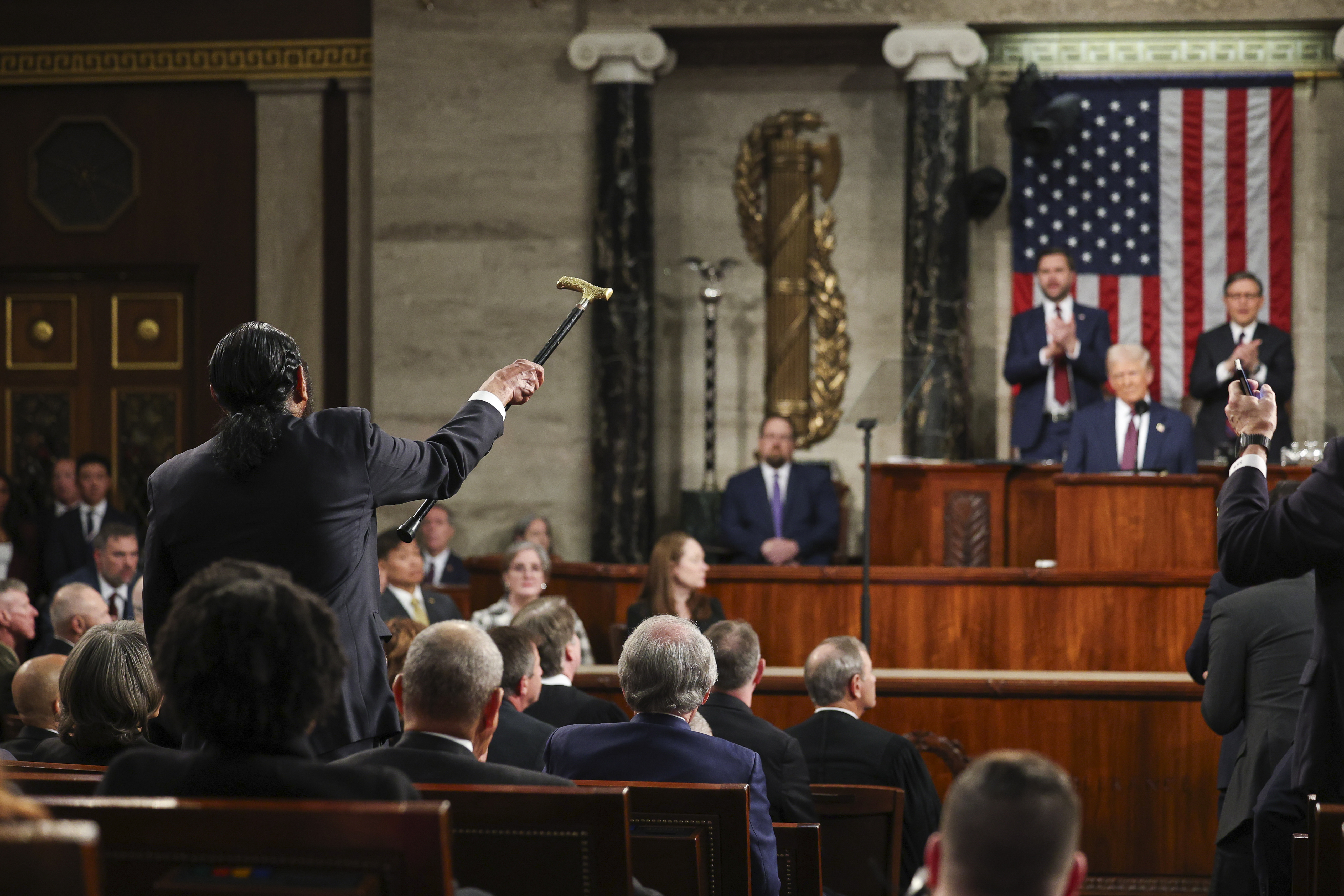 Rep. Al Green, D-Texas (left) shouts as President Donald Trump addresses a joint session of Congress at the Capitol in Washington, Tuesday, March 4, 2025.<br />(Win McNamee / Pool Photo via AP)