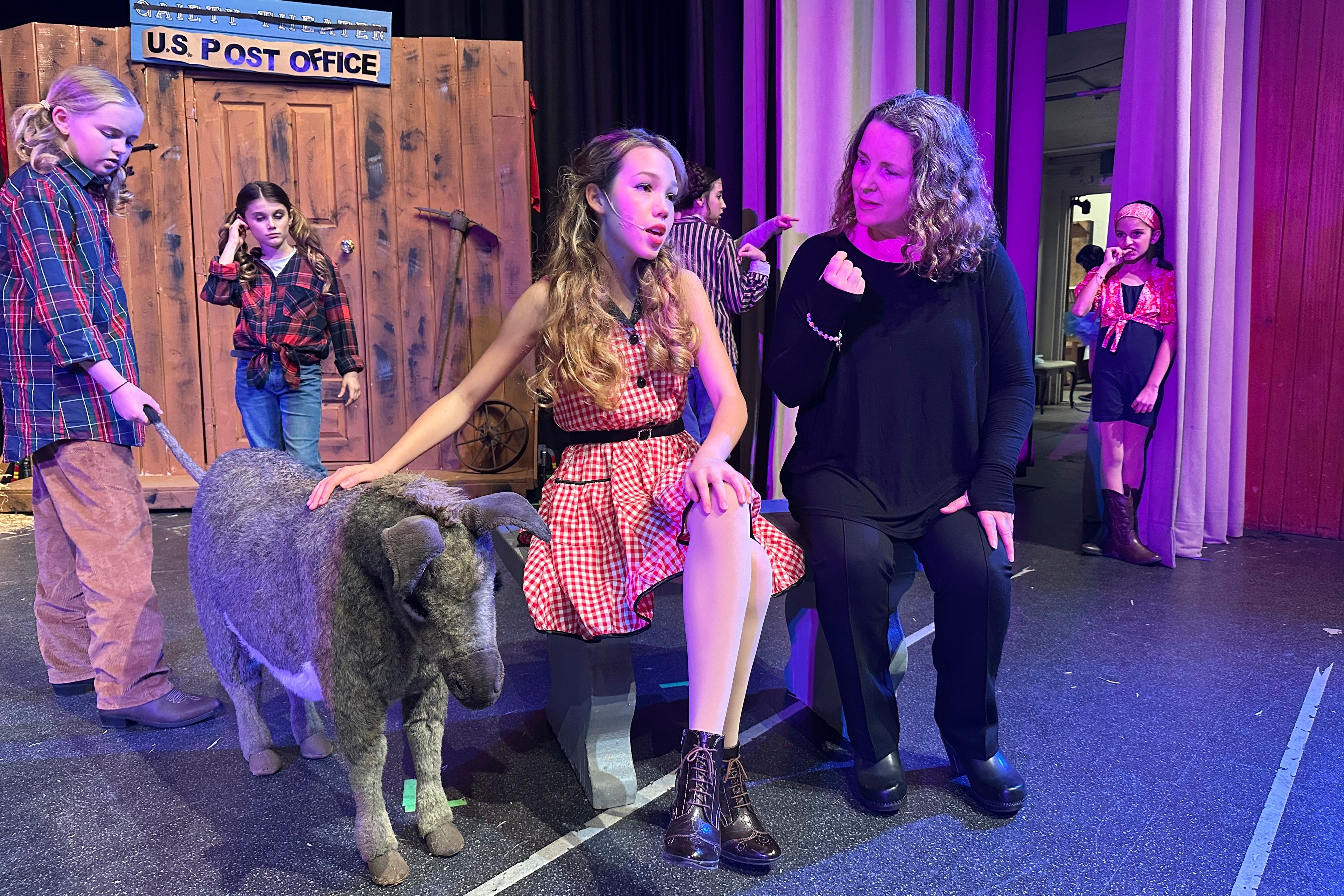 Lara Ganz (right) director of Theatre Palisades Youth, works on blocking with Anna Telehowski, 14 (left) on opening night of the musical “Crazy for You” after the group lost their theater in the Palisades fire, Los Angeles, Calif., Feb. 28, 2025.<br />(Jocelyn Gecker / AP Photo)