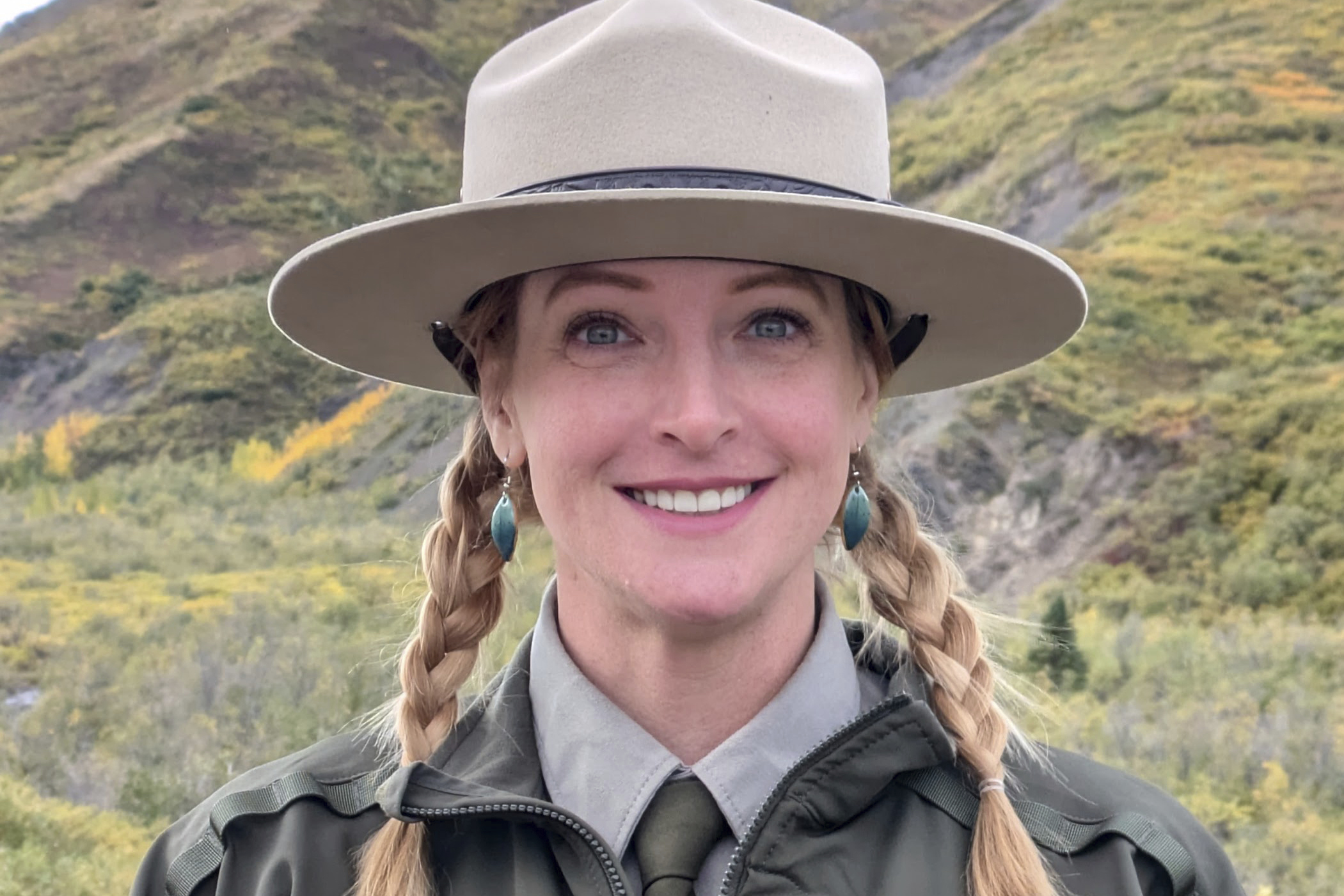 This photo provided by Kristin Jenn shows her in her National Park Service ranger uniform in Denali National Park and Preserve in Alaska in October 2024, while she was a seasonal worker for the NPS.<br />(Kristin Jenn via AP)