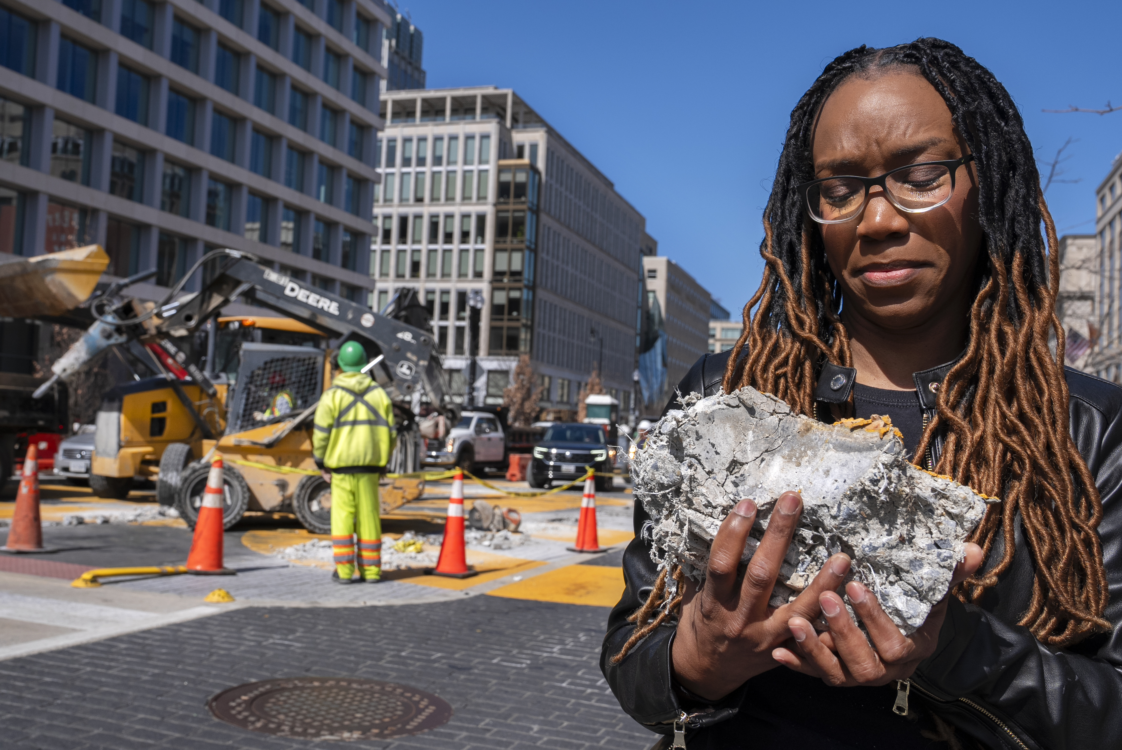 Tears roll down the face of Starlette Thomas, of Bowie, Md., as she holds a chunk of pavement from the Black Lives Matter mural, Monday, March 10, 2025.<br />(Jacquelyn Martin / AP Photo)
