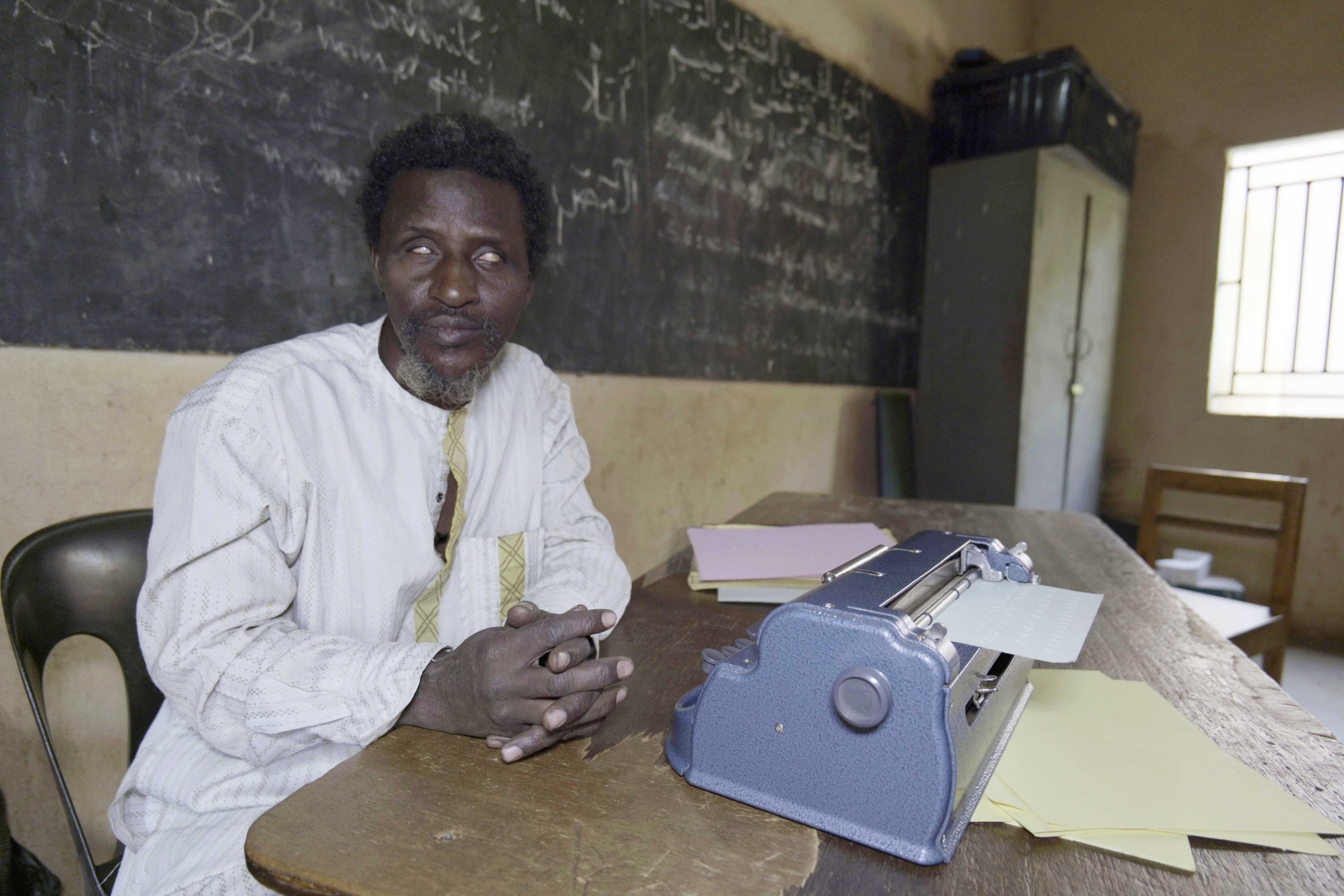 Ali Moustapha Dicko, who teaches at the institute for the blind, shows the use of a Standard Perkins Braille machine in Bamako, Mali, Wednesday, Jan. 15, 2025.<br />(Moustapha Diallo / AP Photo)