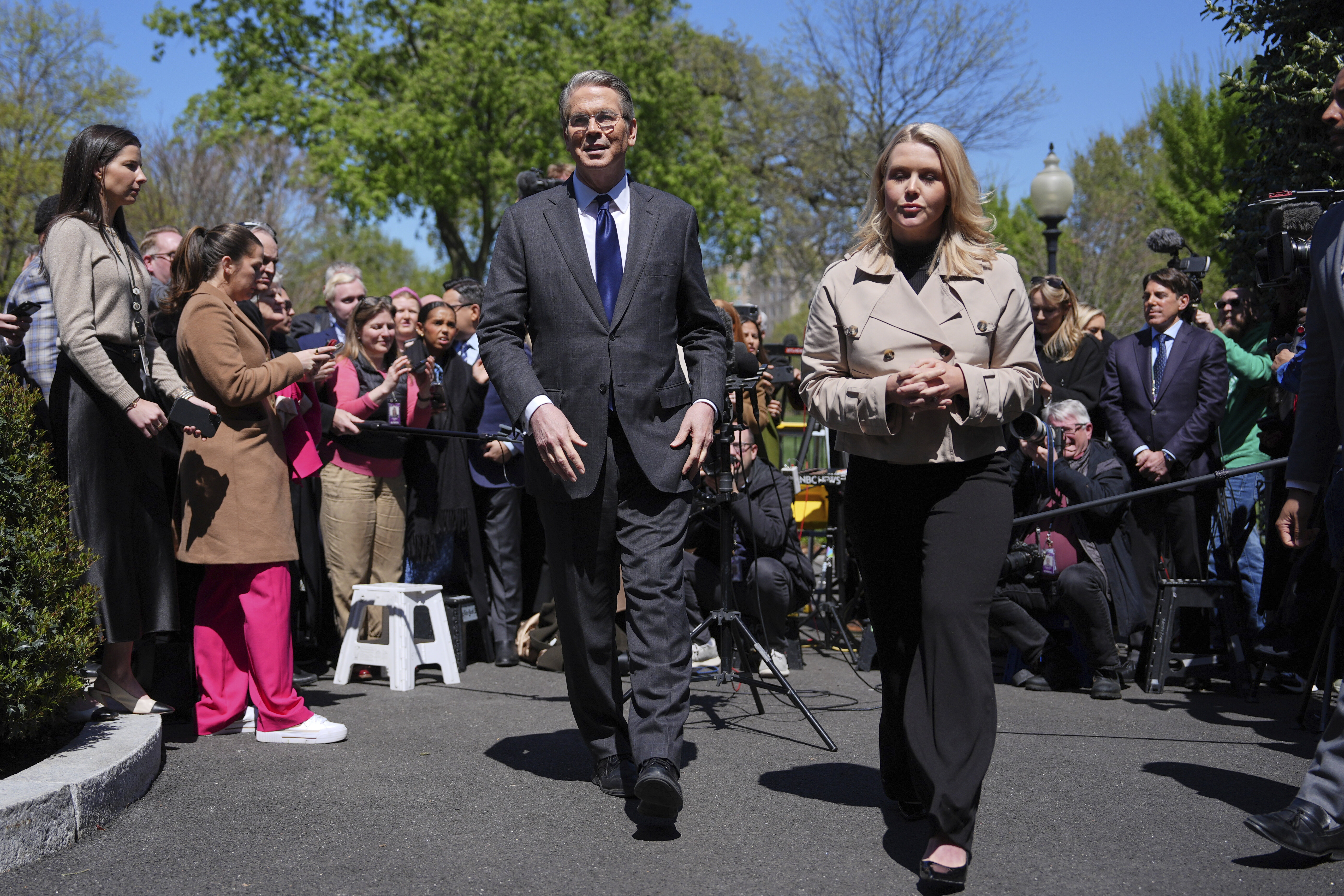 Treasury Secretary Scott Bessent and White House press secretary Karoline Leavitt depart after speaking to reporters outside the West Wing of the White House, Wednesday, April 9, 2025, in Washington.<br />(Evan Vucci / AP Photo)