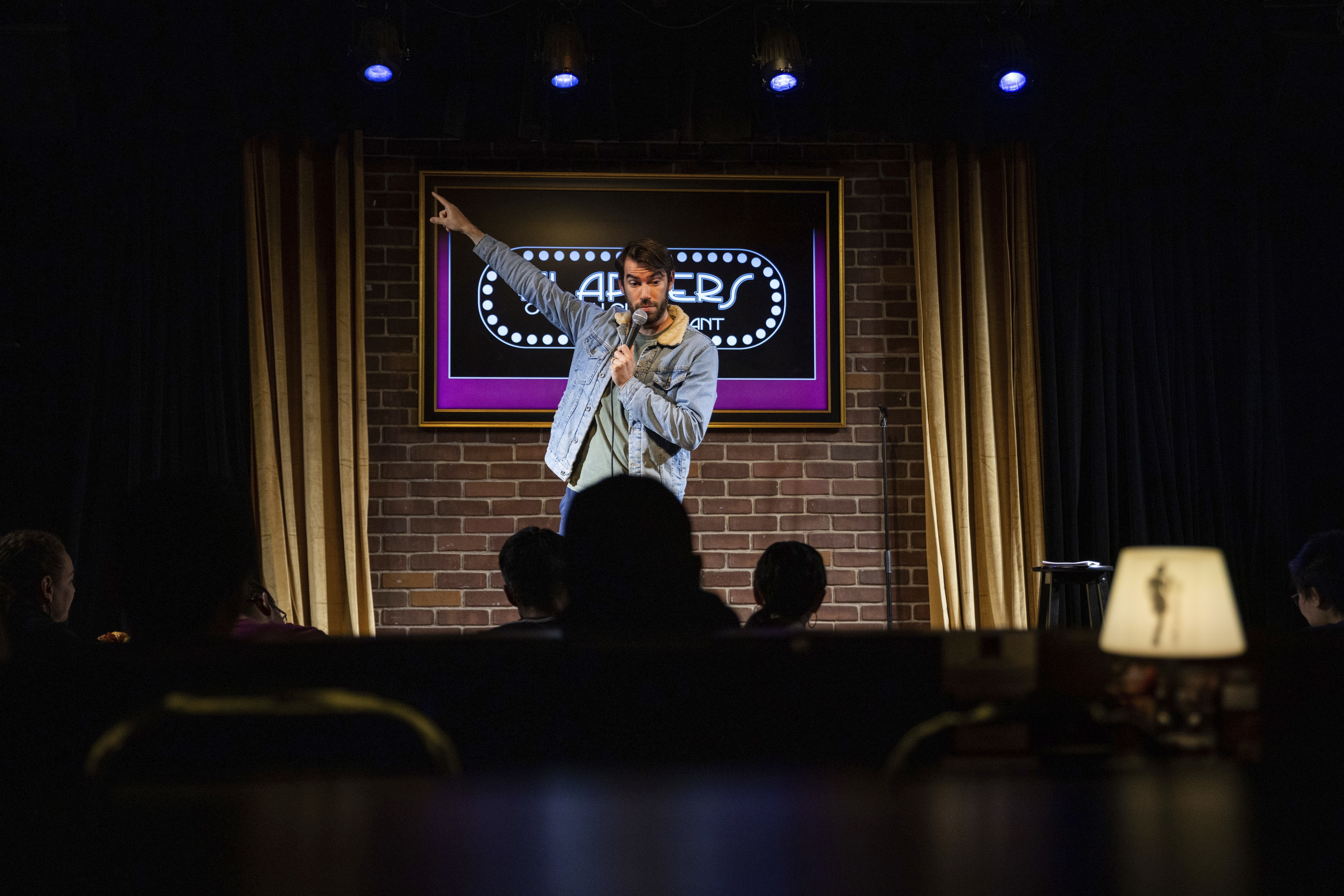Esteban Gast performs during Stand Up For Climate, a comedy show at Flappers Comedy on Thursday, March 20, 2025, in Burbank, Calif.<br />(Ethan Swope / AP Photo)