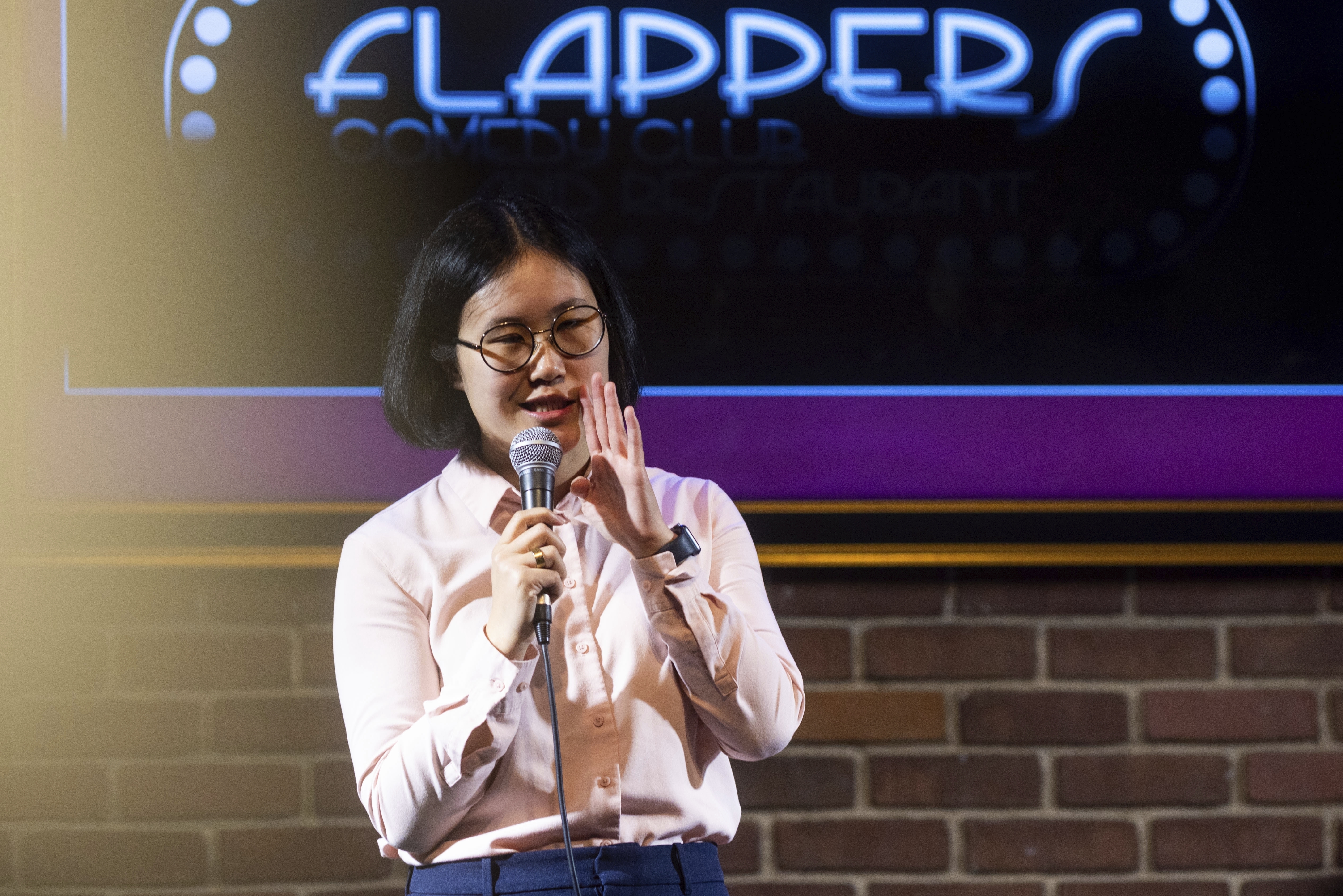 Corinna Yee performs during Stand Up For Climate, a comedy show at Flappers Comedy on Thursday, March 20, 2025, in Burbank, Calif.<br />(Ethan Swope / AP Photo)