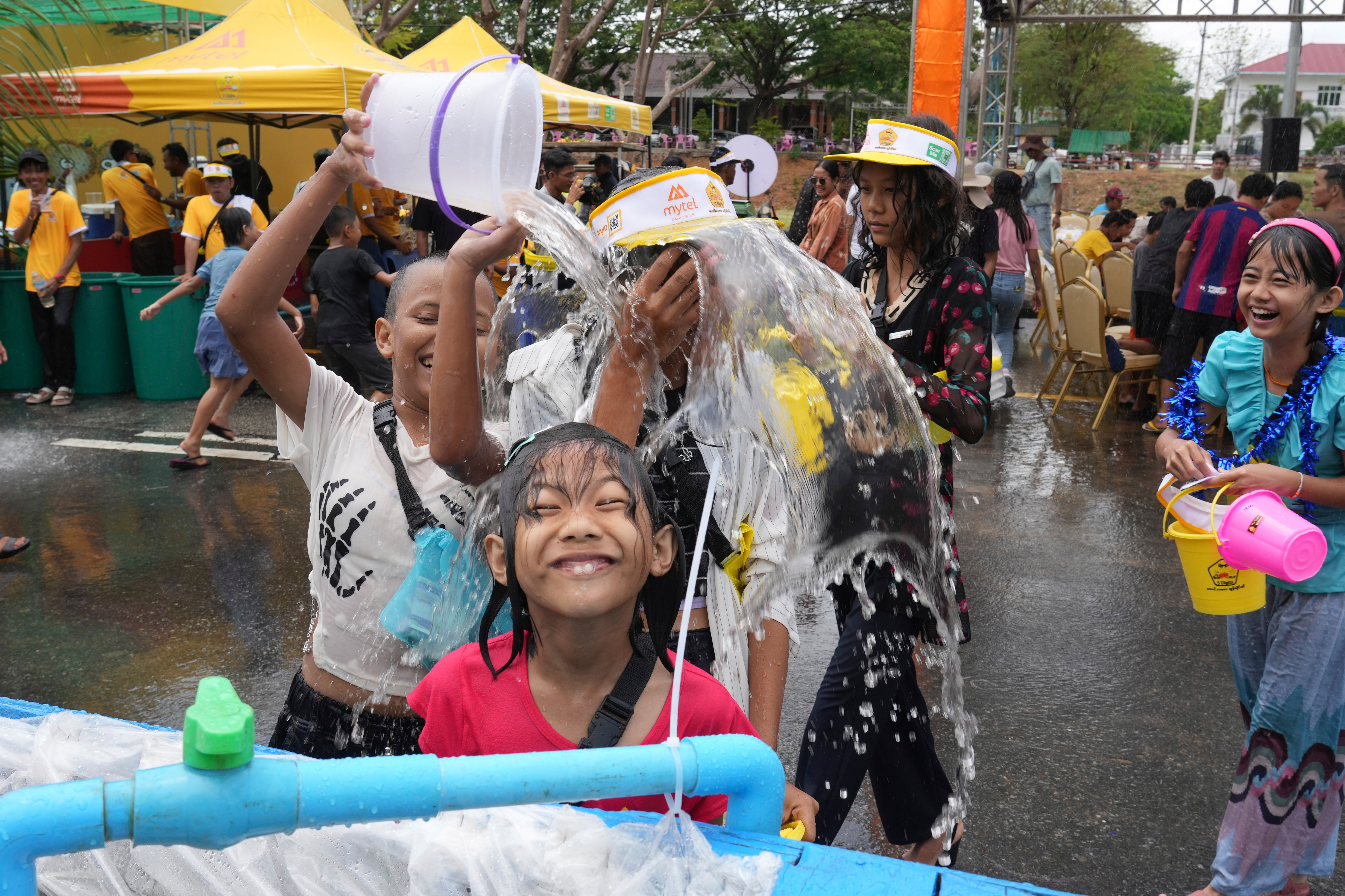 People take part in the first day of annual water festival also known as &quot;Thingyan,&quot; in Naypyitaw, Myanmar, Sunday, April 13, 2025.<br />(Aung Shine Oo / AP Photo)