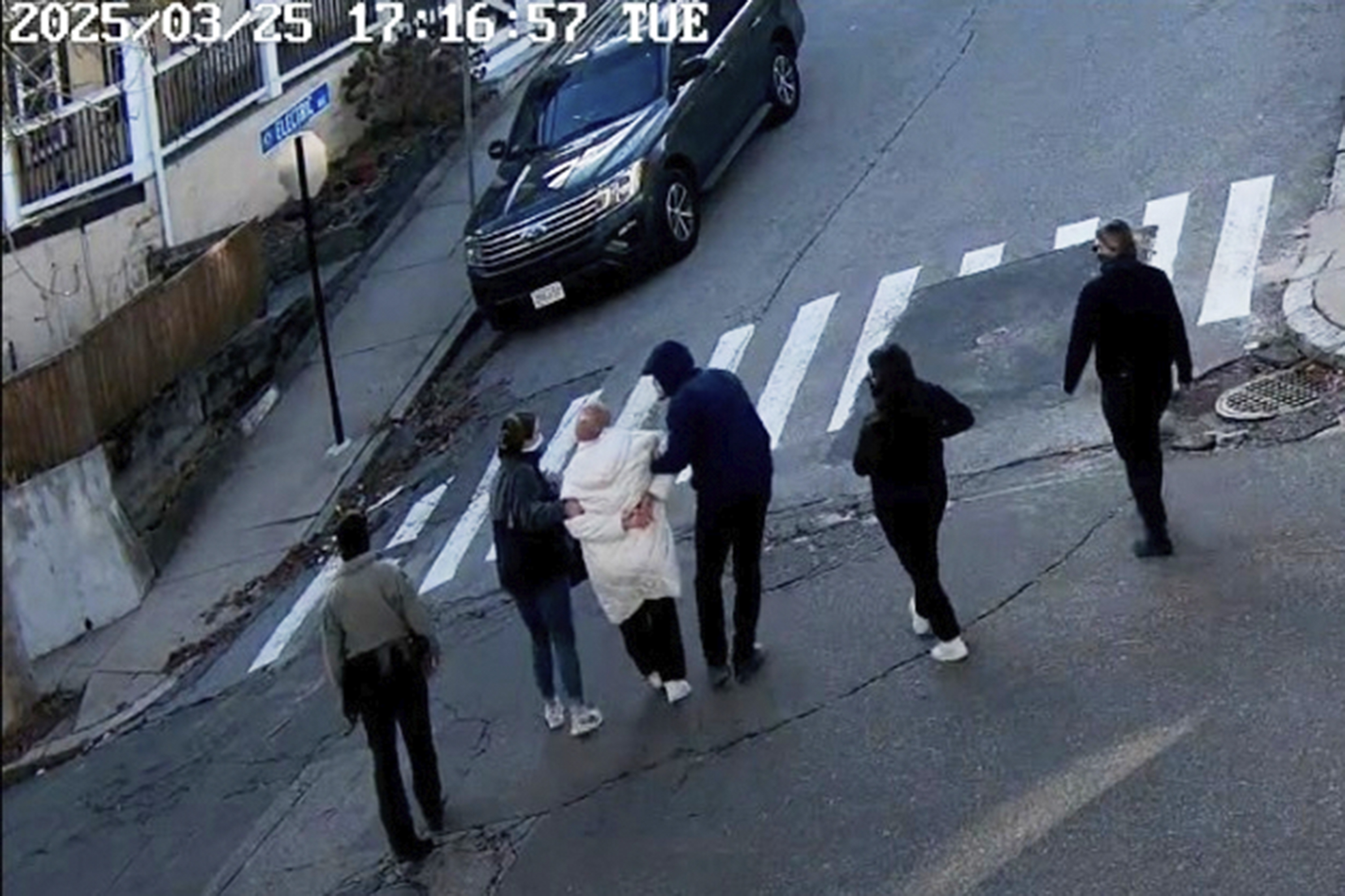 In this image taken from security camera video, Rumeysa Ozturk, a 30-year-old doctoral student at Tufts University, is detained by Department of Homeland Security agents on a street in Sommerville, Mass., March 25, 2025.<br />(AP Photo)