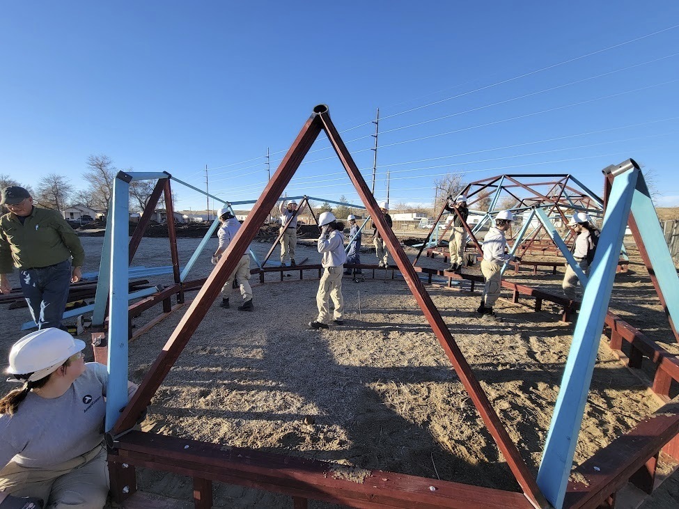 An AmeriCorps team works on a greenhouse in Casper, Wyoming, in 2024 for the Casper Housing Authority, a nonprofit organization that relies on the now-suspended program.<br />(Jamie Purcell / AP Photo)