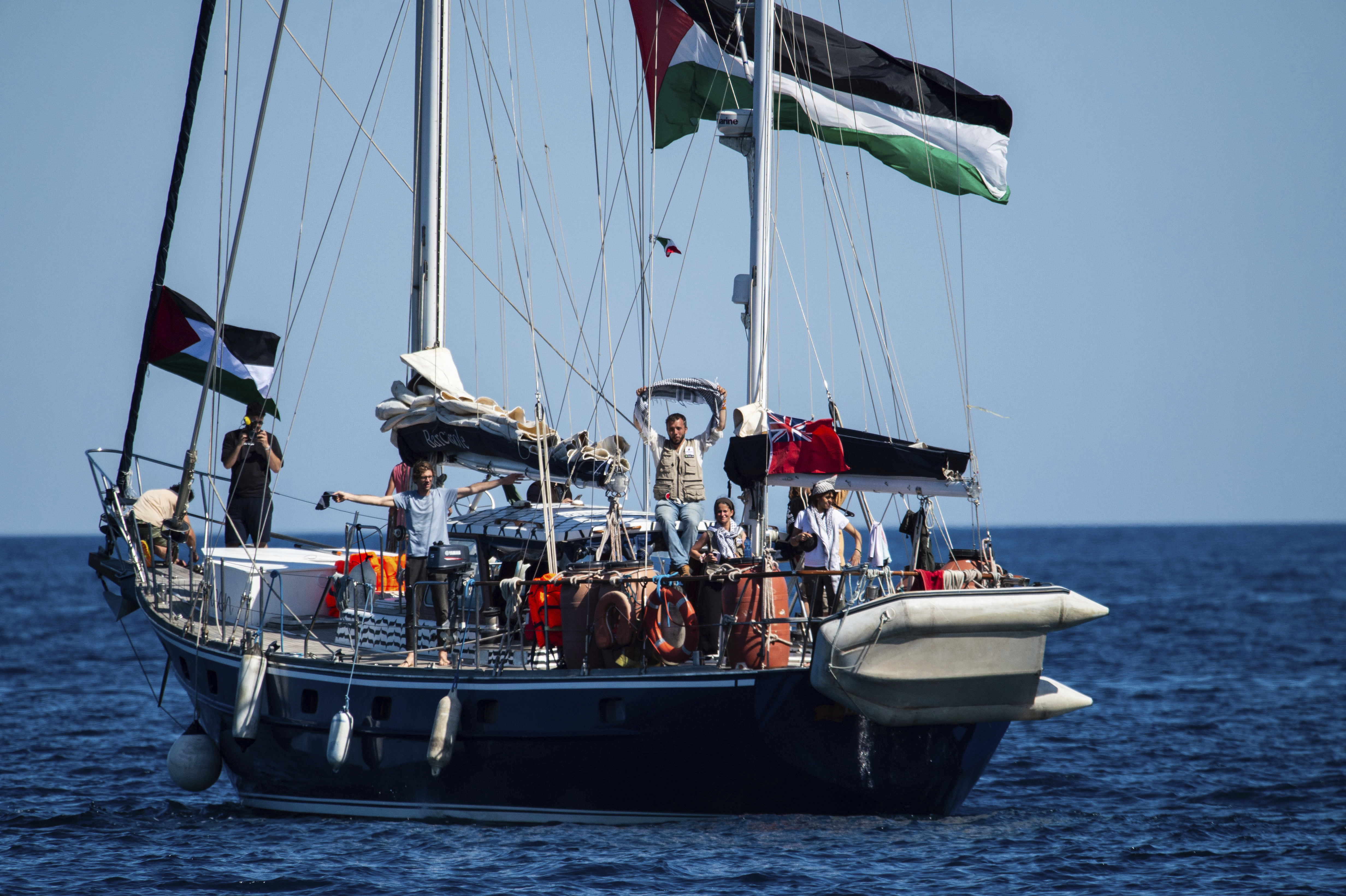 Activists of the Freedom Flotilla Coalition, board the Madleen boat, ahead of setting sail for Gaza, departing from the Sicilian port of Catania, Italy, Sunday, June 1, 2025.<br />(Salvatore Cavalli / AP Photo)