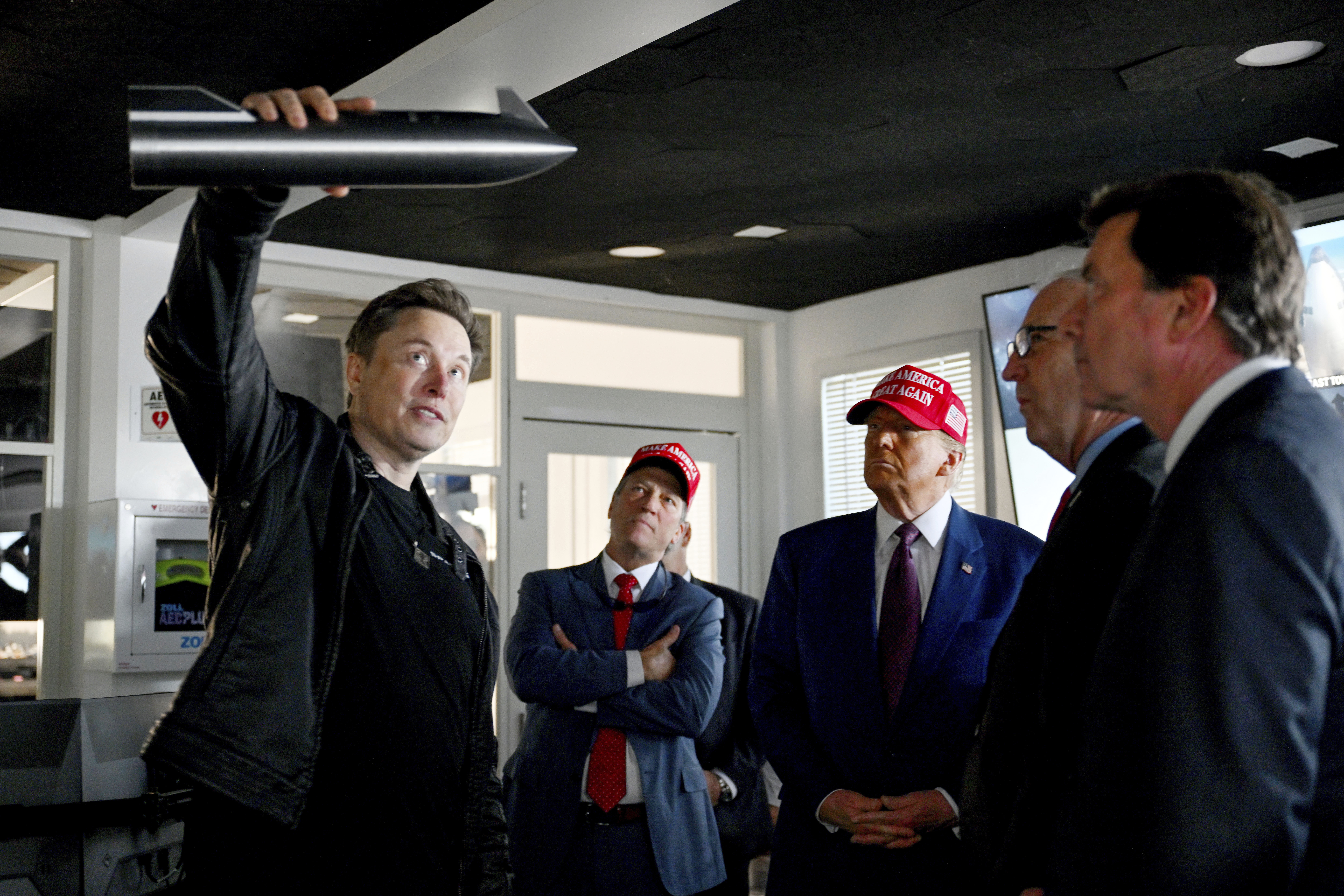 President-elect Donald Trump listens as Elon Musk explains the operations ahead of the launch of the sixth test flight of the SpaceX Starship rocket, Nov. 19, 2024, in Boca Chica, Texas.<br />(Brandon Bell / Pool via AP)