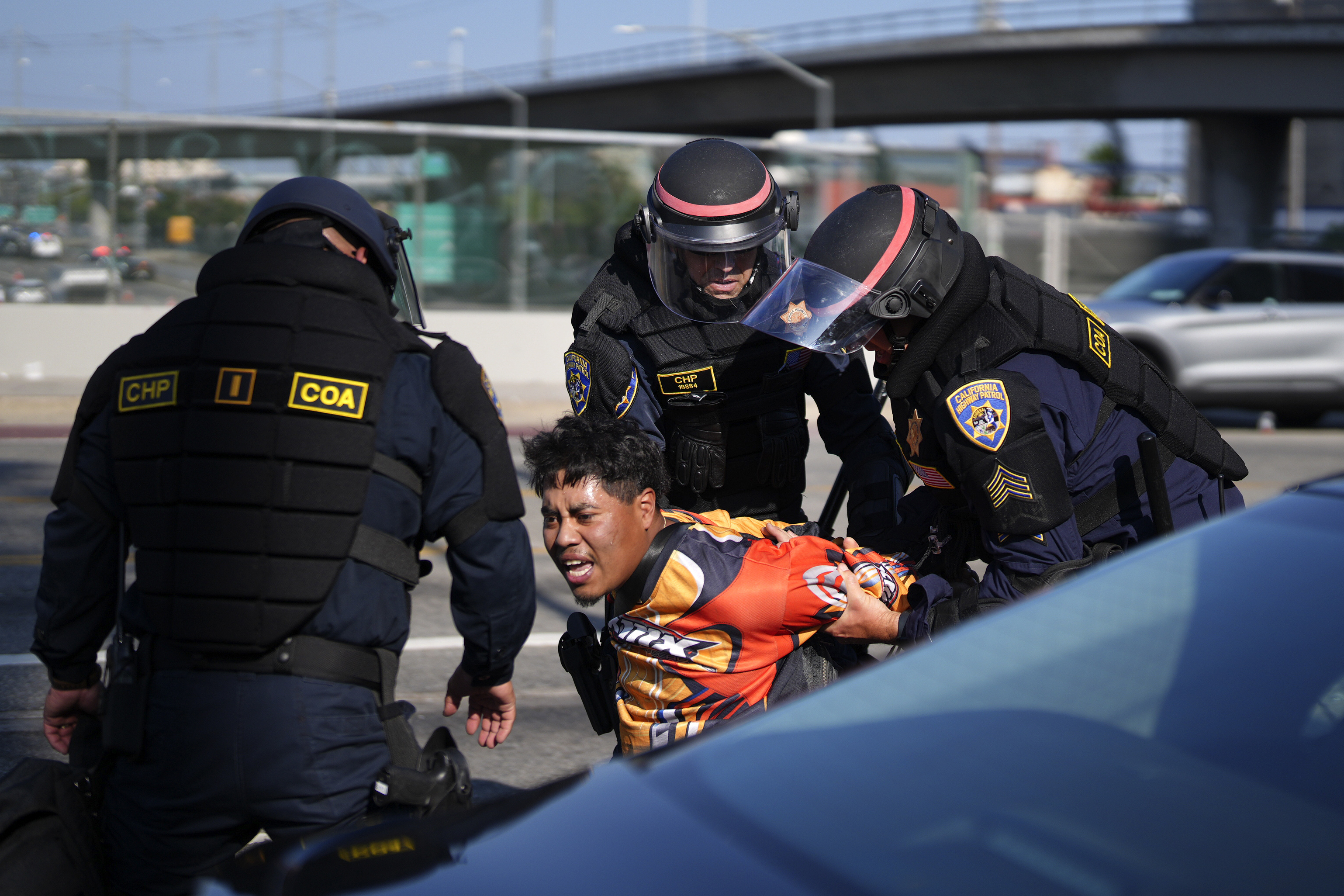 A protester is arrested by California Highway Patrol near the federal building in downtown Los Angeles on Tuesday, June 10, 2025.<br />(Eric Thayer / AP Photo)