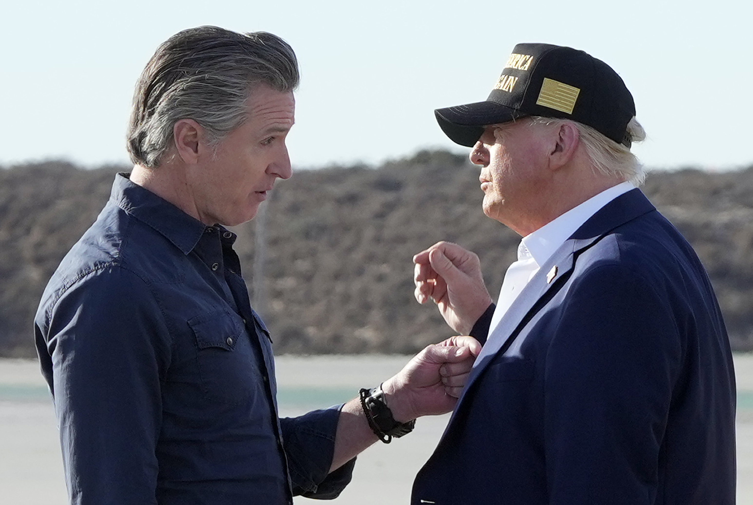 President Donald Trump talks with California Gov. Gavin Newsom after arriving on Air Force One at Los Angeles International Airport in Los Angeles, Jan. 24, 2025.<br />(Mark Schiefelbein / AP Photo)