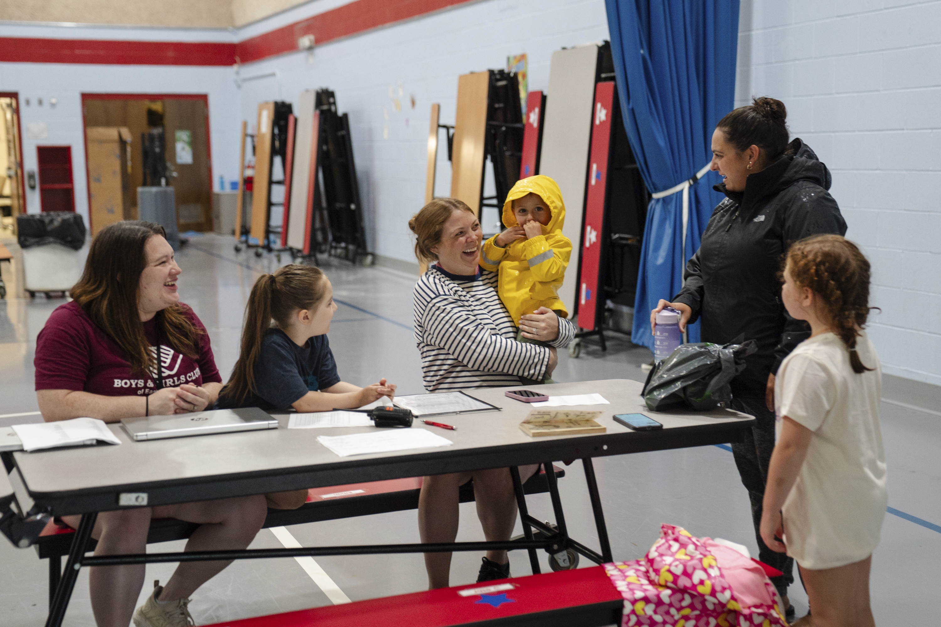 A parent drops their children off at the East Providence Boys and Girls Club Summer Camp at Emma G. Whiteknact Elementary School on Thursday, July 10, 2025, in Providence R.I.<br />(Sophie Park / AP Photo)