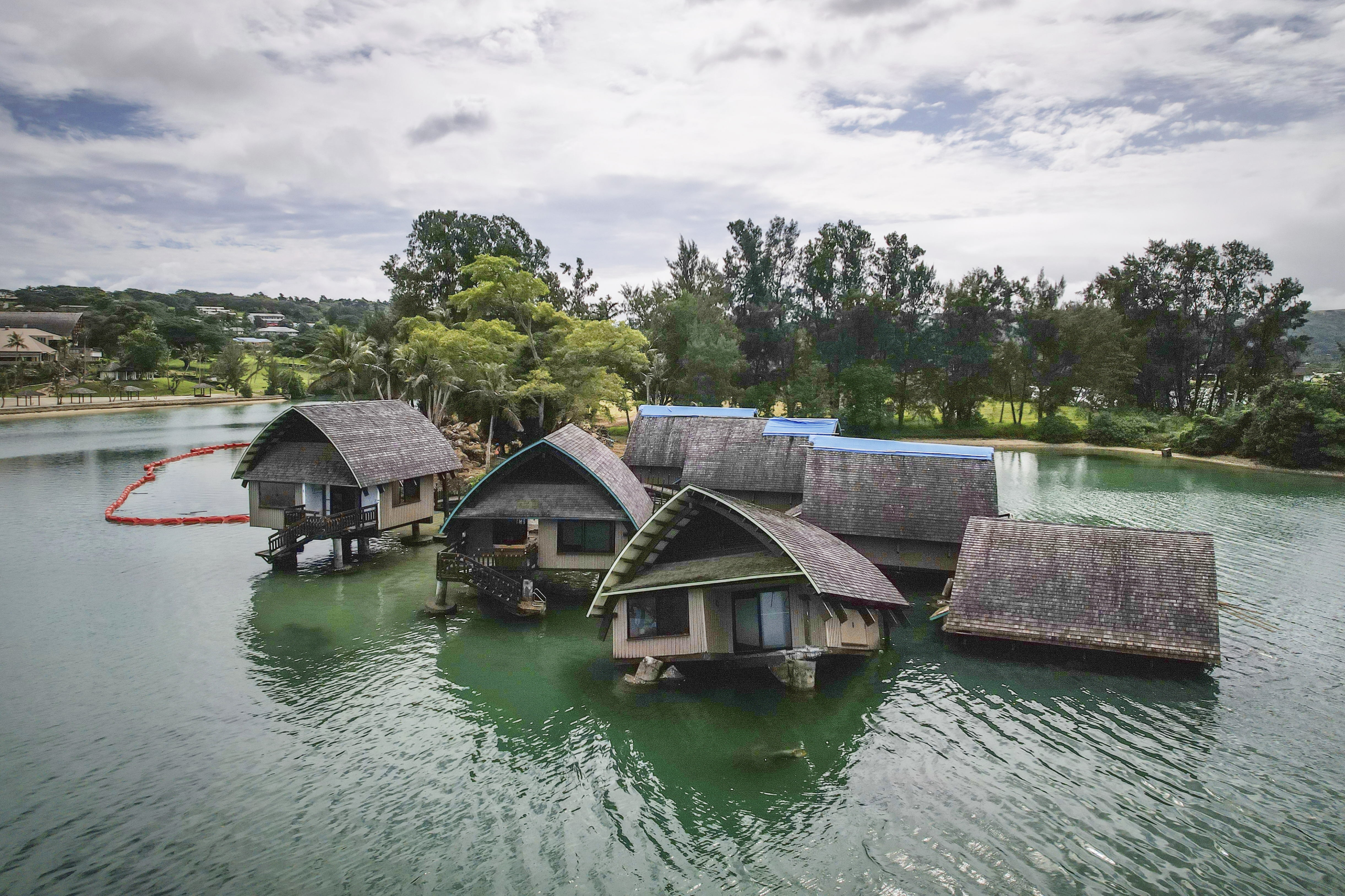 The once iconic Holiday Inn villas in Port Vila, Vanuatu, sit partially sunken Saturday, July 19, 2025, after being hit by multiple cyclones and an earthquake that caused irreparable damage.<br />(Annika Hammerschlag / AP Photo)