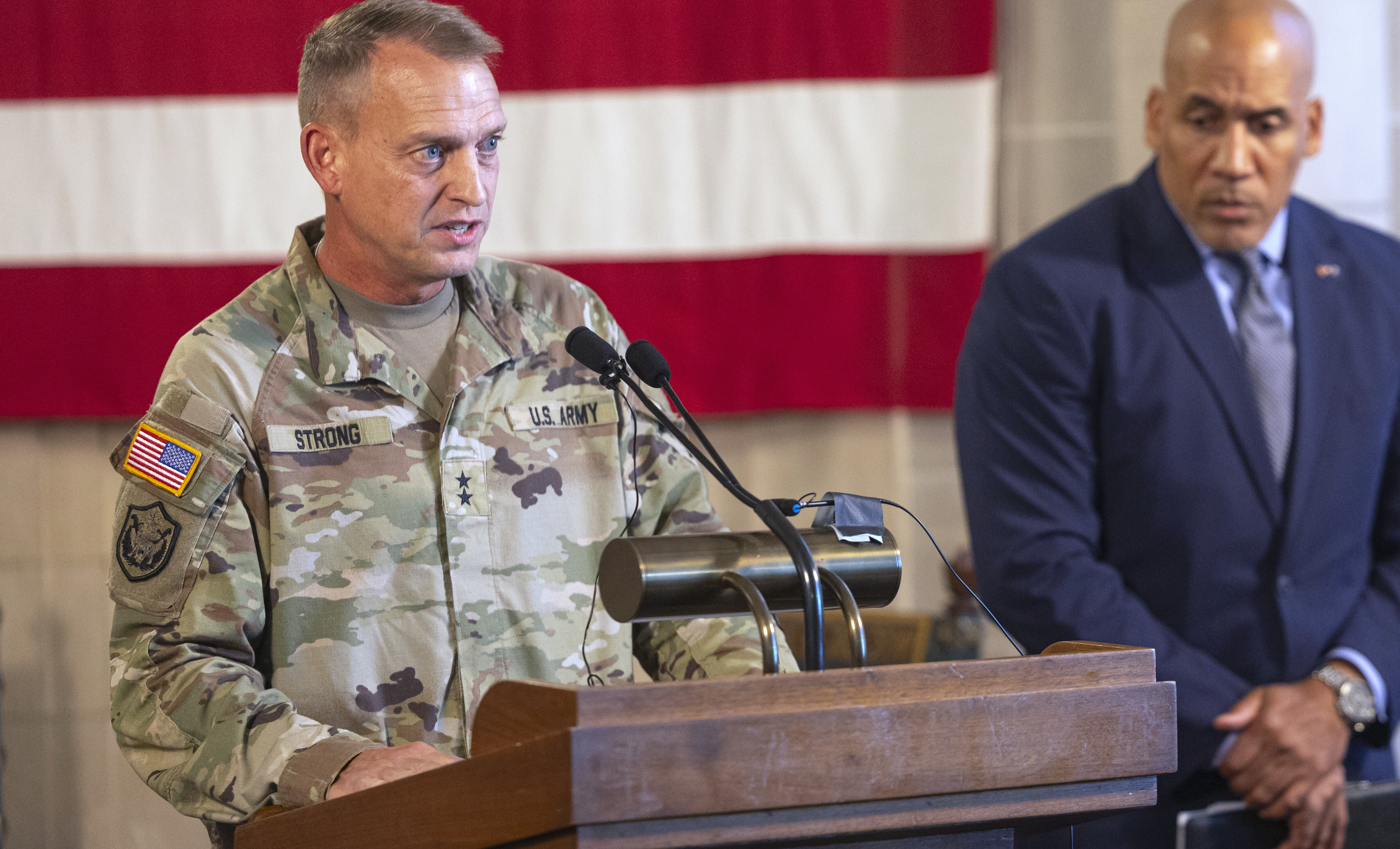 Neb. National Guard Maj. Gen. Craig W. Strong (left) speaks as Neb. Department of Correctional Services Director Rob Jeffreys (right) listens on Tuesday, Aug. 19, 2025, during a news conference at the State Capitol in Lincoln, Neb., where officials discussed plans to use the Work Ethic Camp in McCook as an immigration detention center.<br />(Arthur H. Trickett-Wile / Lincoln Journal Star via AP)
