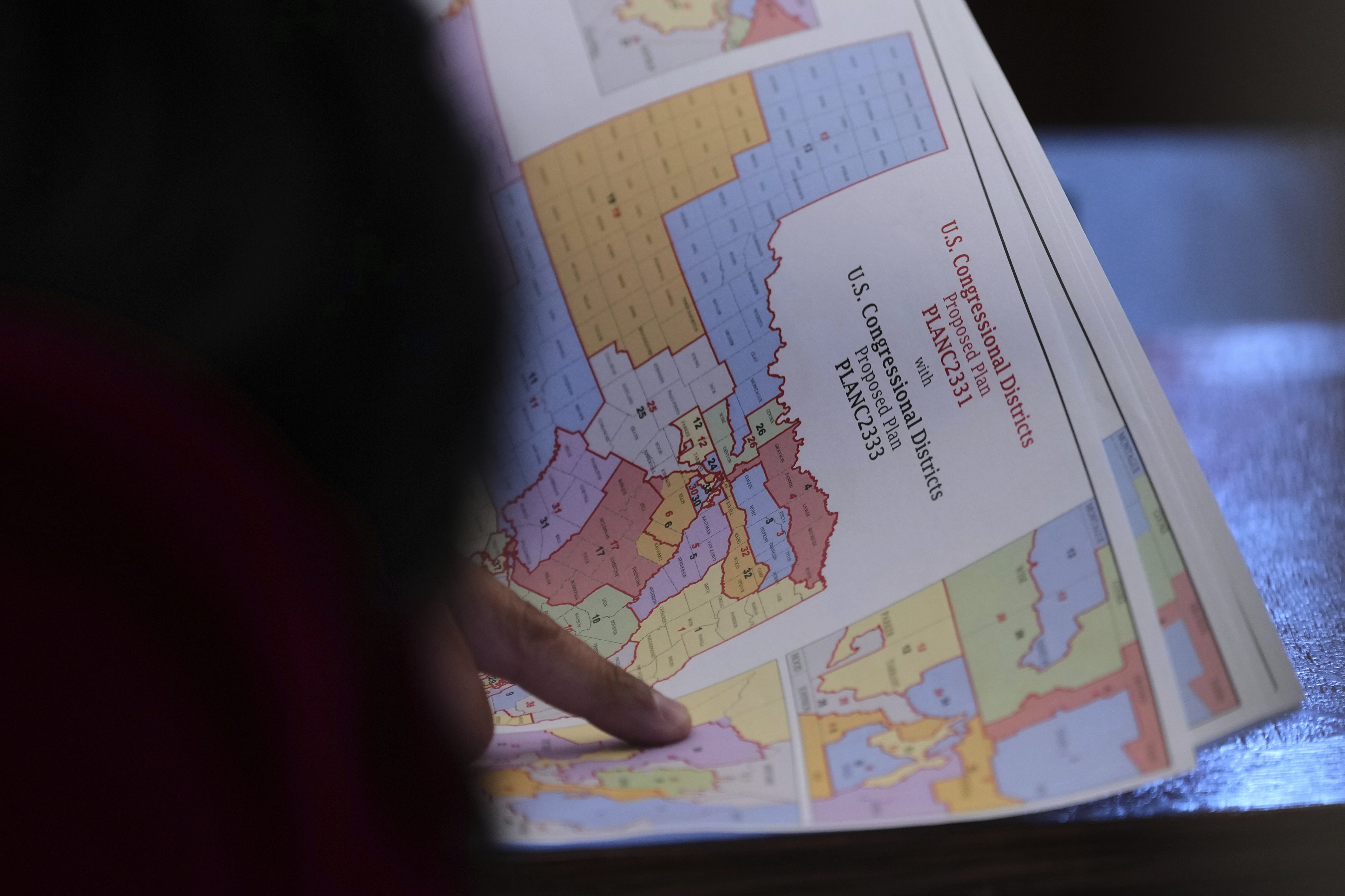 Texas state Rep. Marc LaHood looks over a map as lawmakers prepare to debate a redrawn U.S. congressional map in Texas during a special, Wednesday, Aug. 20, 2025, in Austin, Texas.<br />(Eric Gay / AP Photo)
