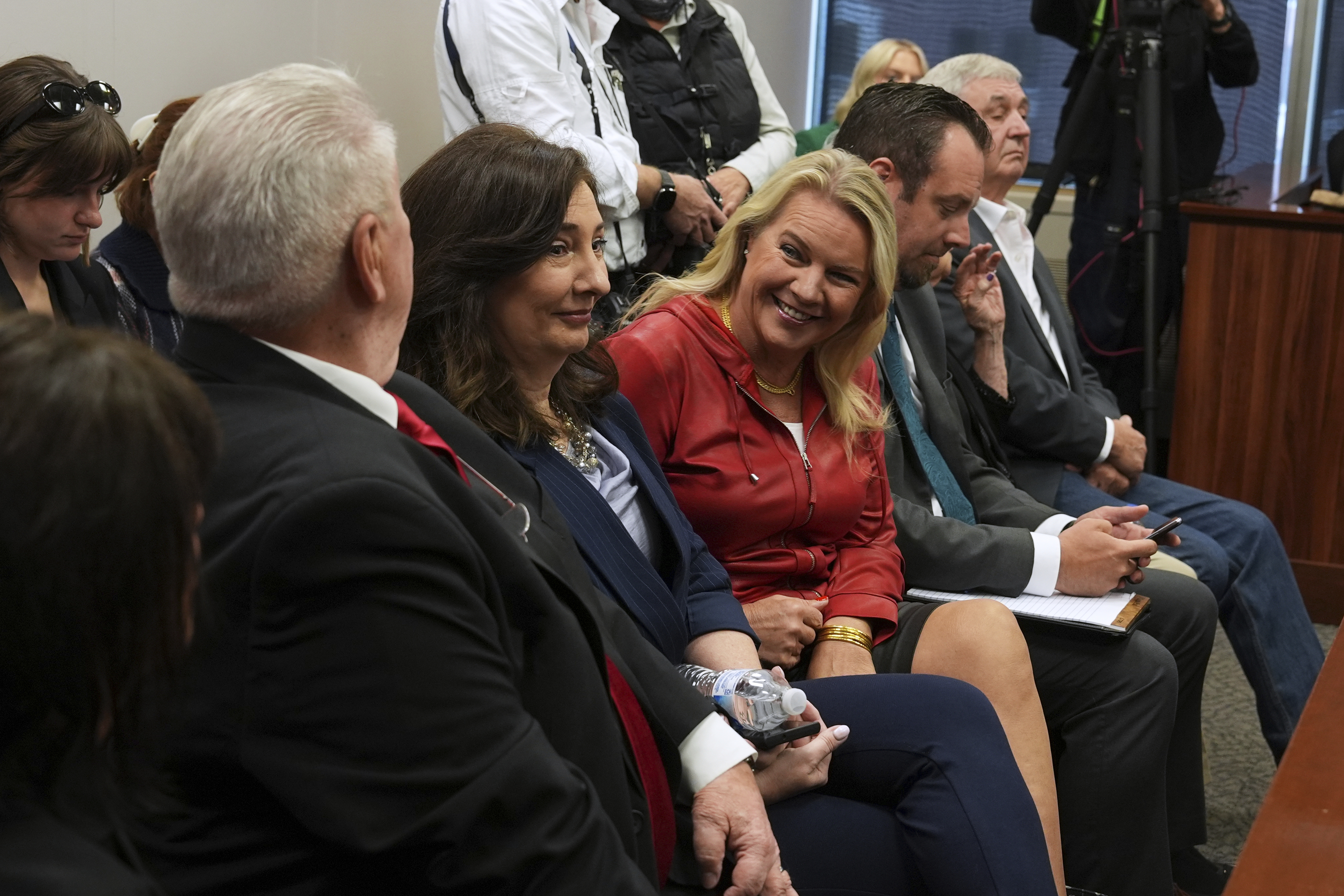 Clifford Frost, from left: Amy Facchinello, Meshawn Maddock, an unidentified attorney and Hank Choate appear during a district court hearing where a Michigan judge dismissed the criminal cases against 15 people accused of acting falsely as electors for President Donald Trump in the 2020 election Tuesday, Sept. 9, 2025 in Lansing, Mich.<br /> (Paul Sancya / AP Photo)