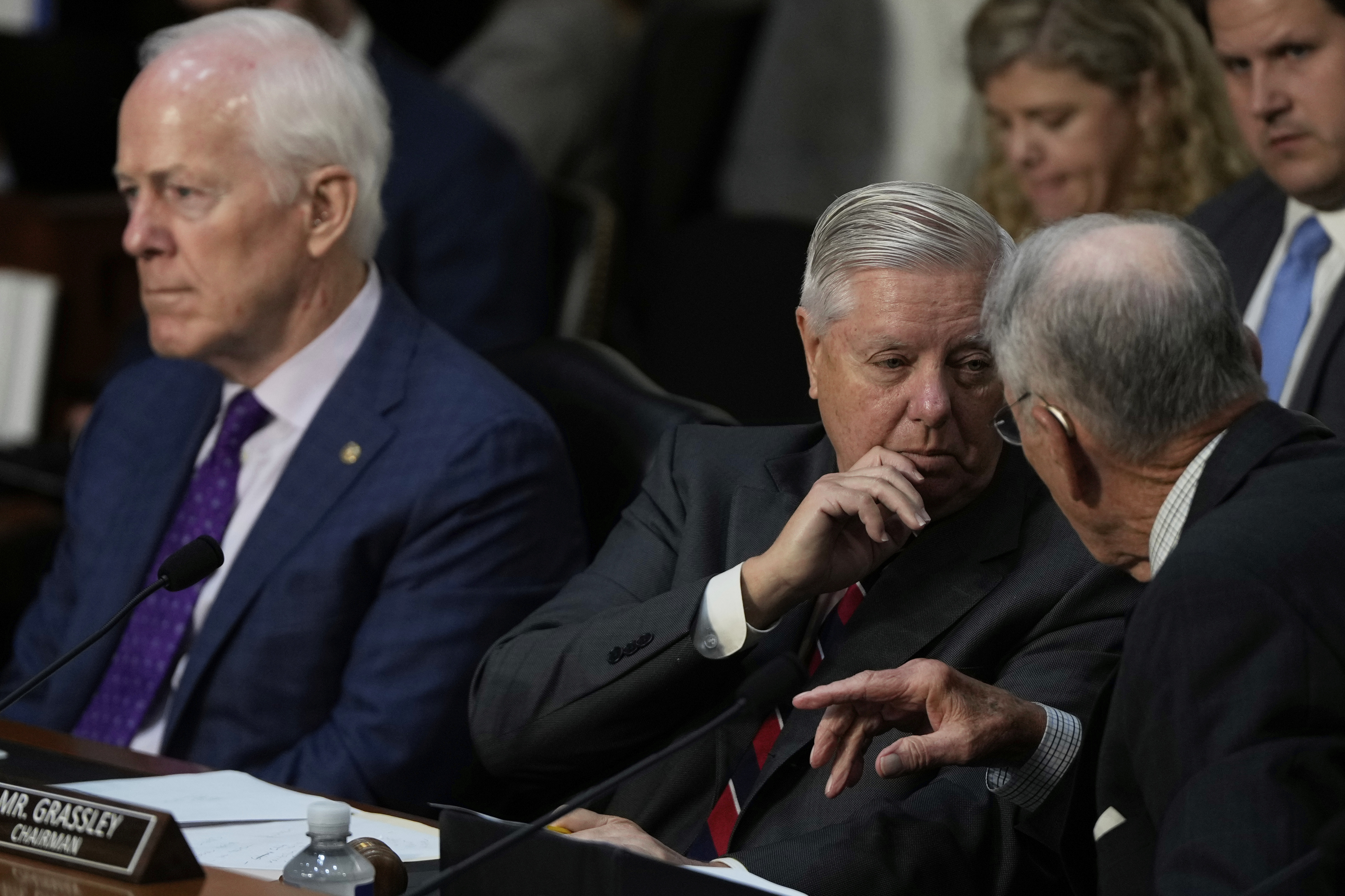 Sen. Lindsey Graham, R-S.C. (center) talks to Sen. Chuck Grassley, R-Iowa (right) as FBI Director Kash Patel appears before the Senate Judiciary Committee for his first oversight hearing, Tuesday, Sept. 16, 2025, at the Capitol in Washington, as Sen. John Cornyn, R-Texas (left) looks on.<br />(Julia Demaree Nikhinson / AP Photo)