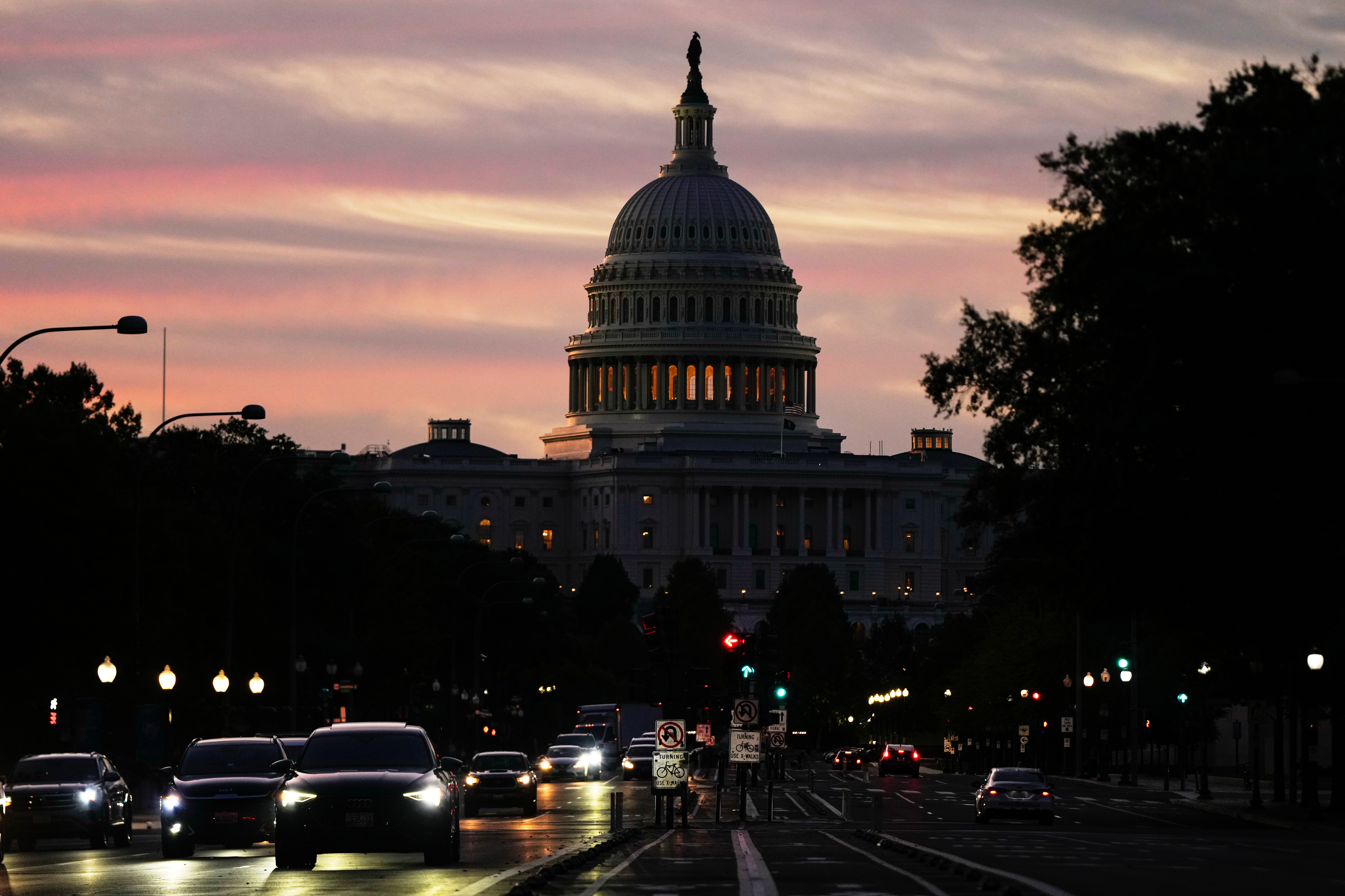 The U.S. Capitol is seen at sunrise as cars drive on Pennsylvania Ave. during rush hour traffic, Wednesday, Oct. 1, 2025, in Washington.<br />(Julia Demaree Nikhinson / AP Photo)