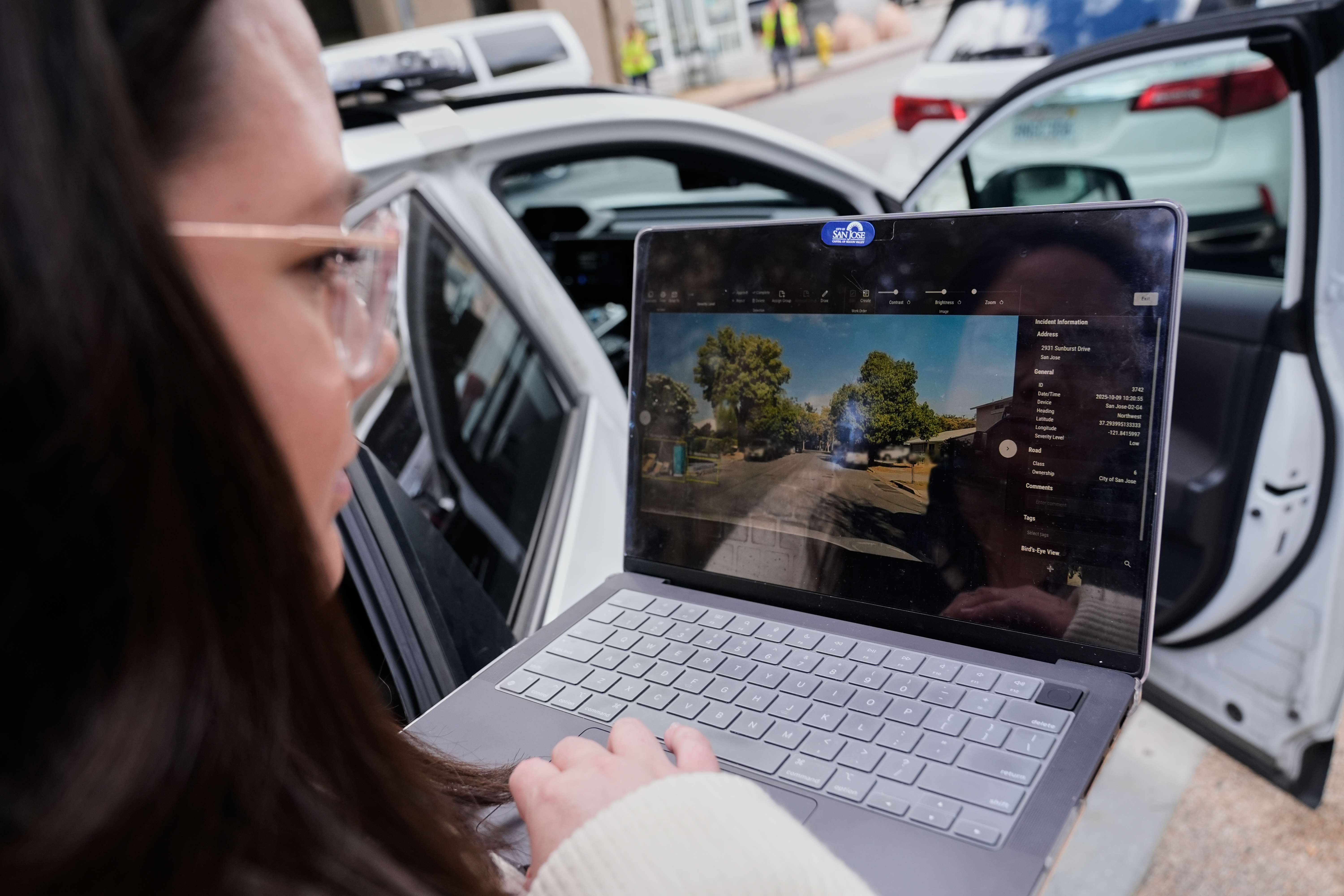 Chelsea Palacio, public information manager for the City of San Jose, showcases how a small detection camera uses AI to detect road hazards and potholes, in San Jose, Calif., Wednesday, Nov. 12, 2025.<br />(Godofredo A. Vásquez / AP Photo)