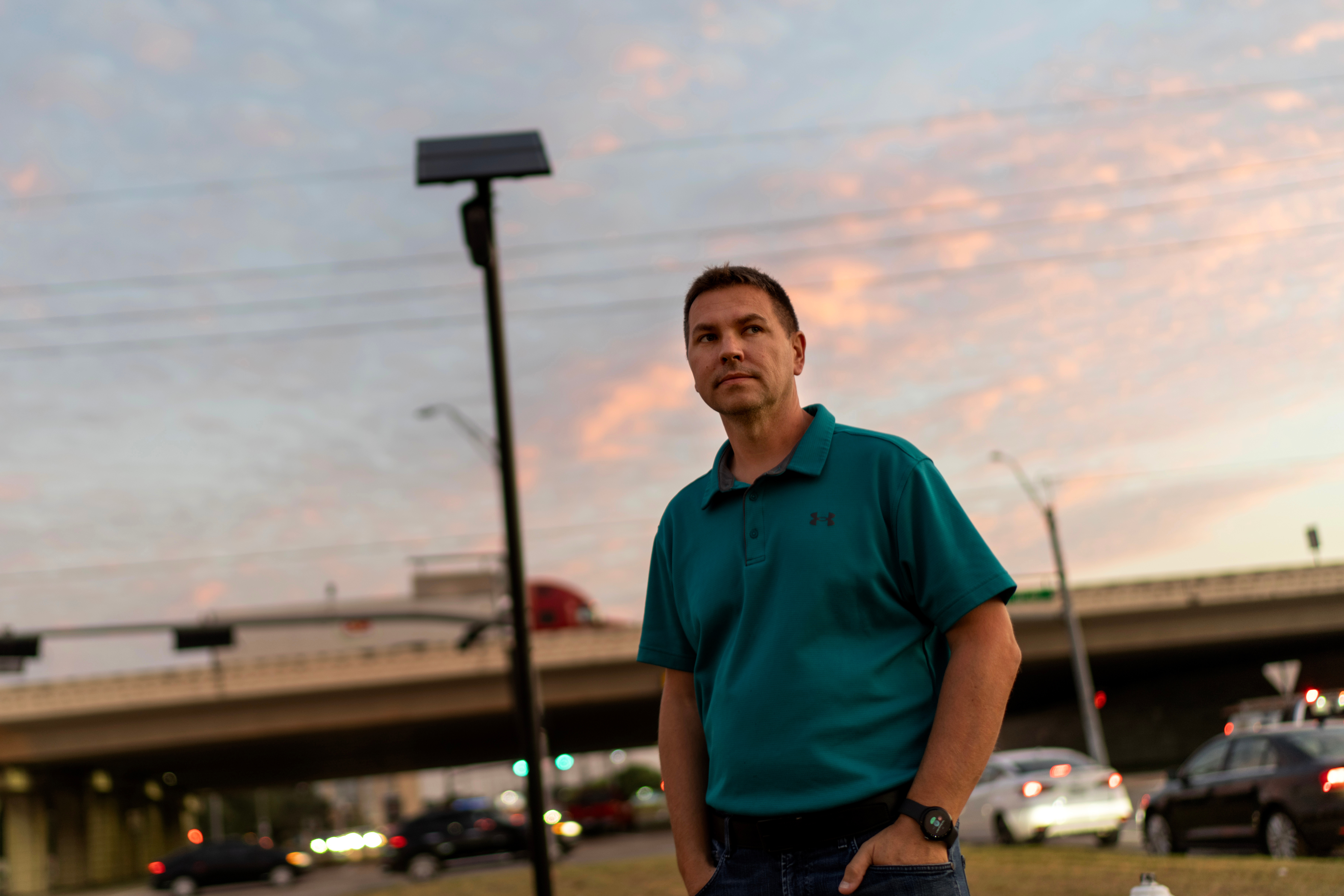 Alek Schott stands next to a Flock Safety license plate reader in his neighborhood, Thursday, Oct. 16, 2025, in Houston.<br />(David Goldman / AP Photo)