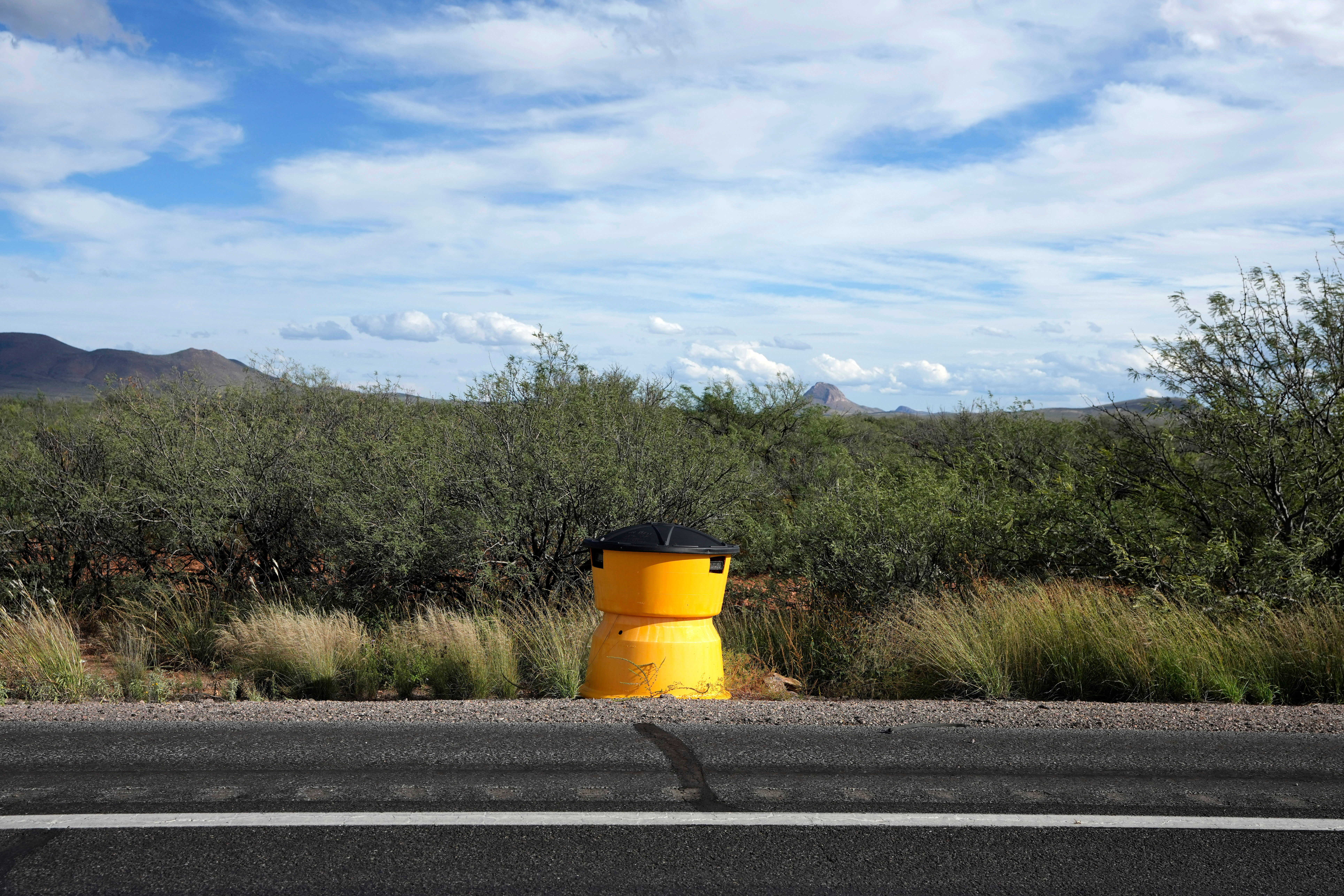 A license plate reader used by U.S. Border Patrol is hidden in a sand crash barrel along the state Highway 80, Thursday, Oct. 23, 2025, in Douglas, Ariz.<br />(Ross D. Franklin / AP Photo)