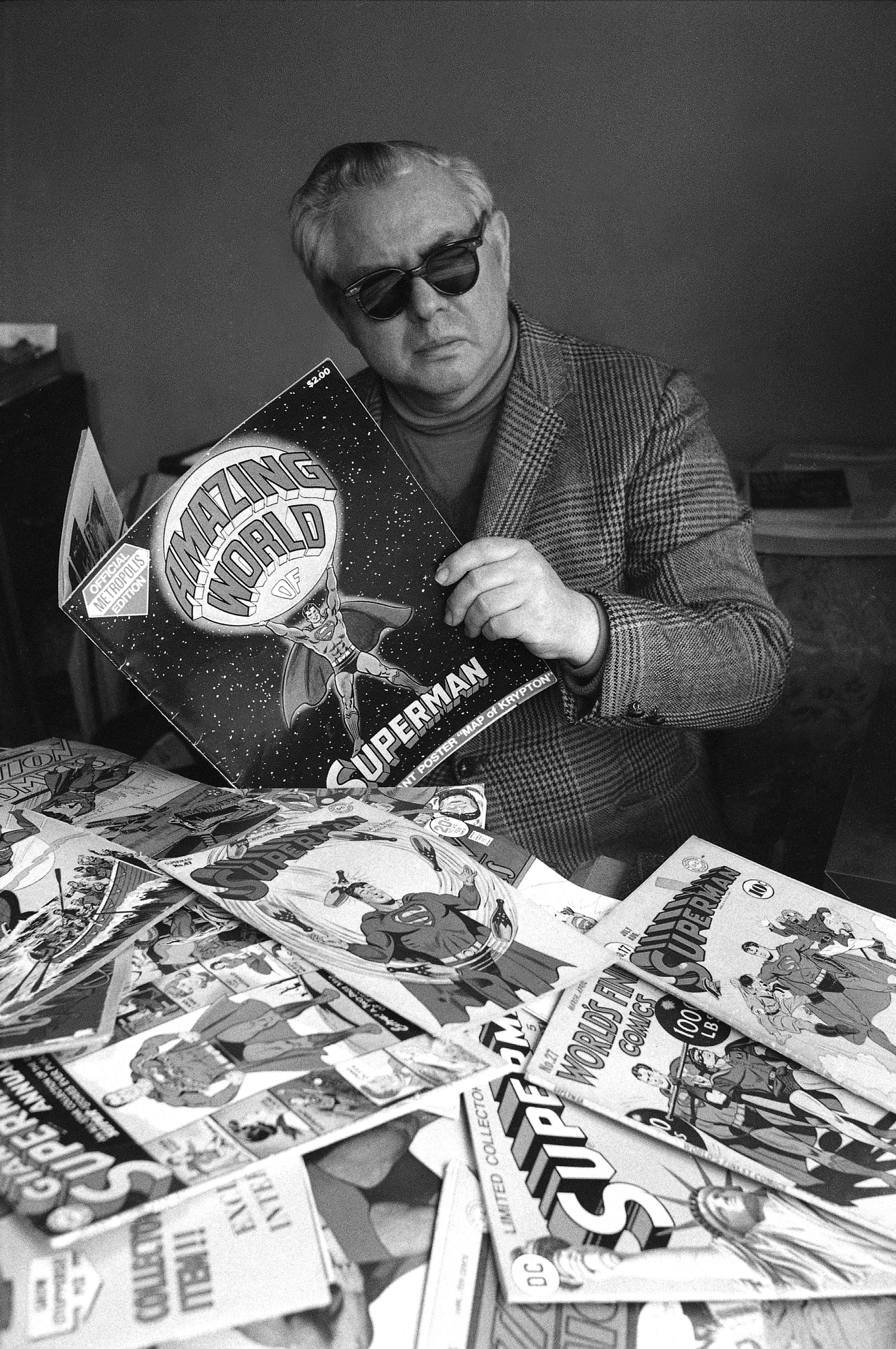 Joe Shuster poses with numerous comic books of Superman, the cartoon character he and writer Jerry Siegel created in 1933, in New York.<br />(AP Photo)