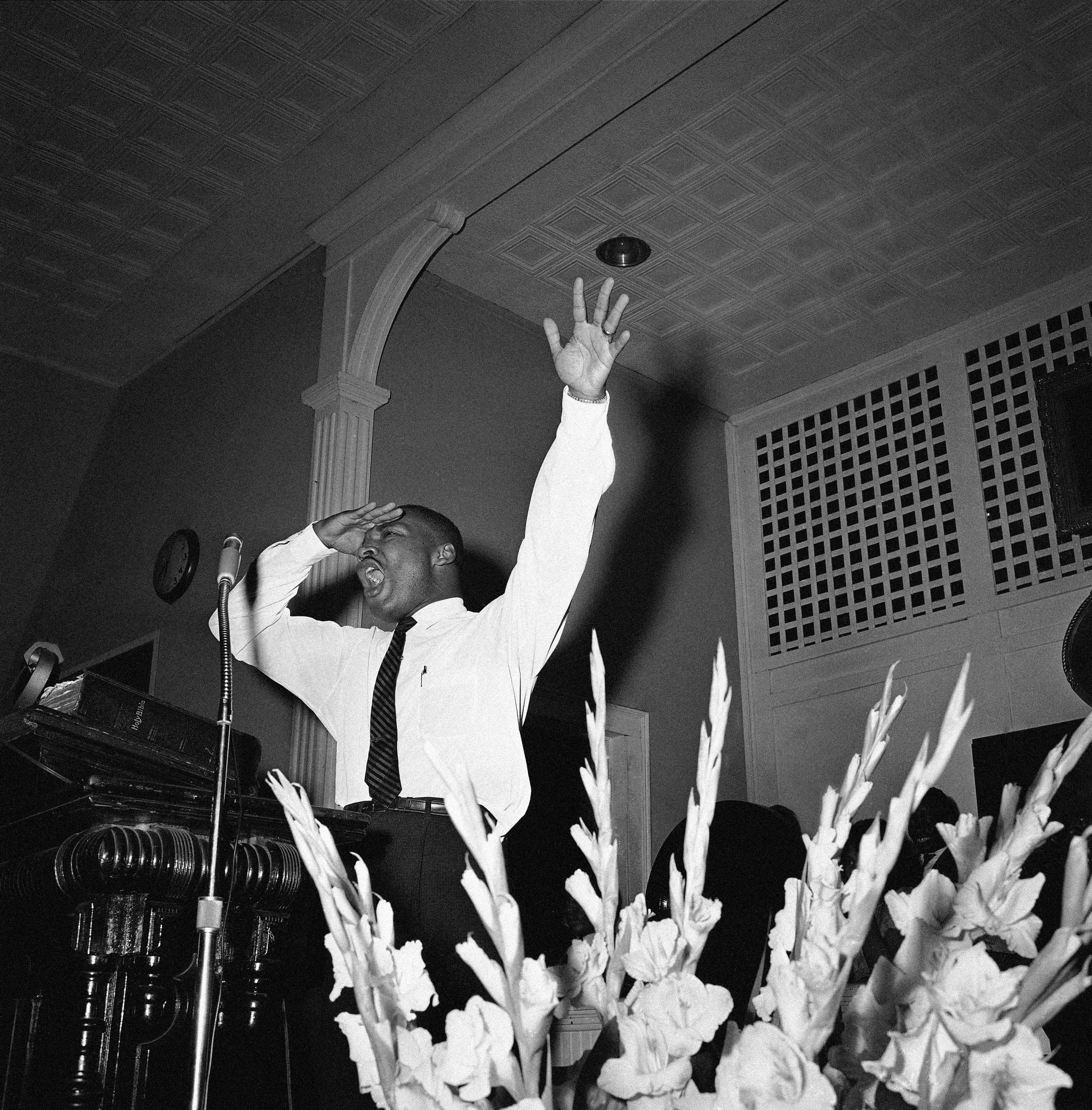 Integration leader Martin Luther King Jr., Atlanta minister, speaking to a church filled to overflowing, in Albany, Georgia on July 22, 1962, about the legal fights ahead. King and other integration leaders and organizations fighting to break down segregation would start court action in an effort to upset a Federal injunction issued on banning protest demonstrations.<br />(AP Photo)