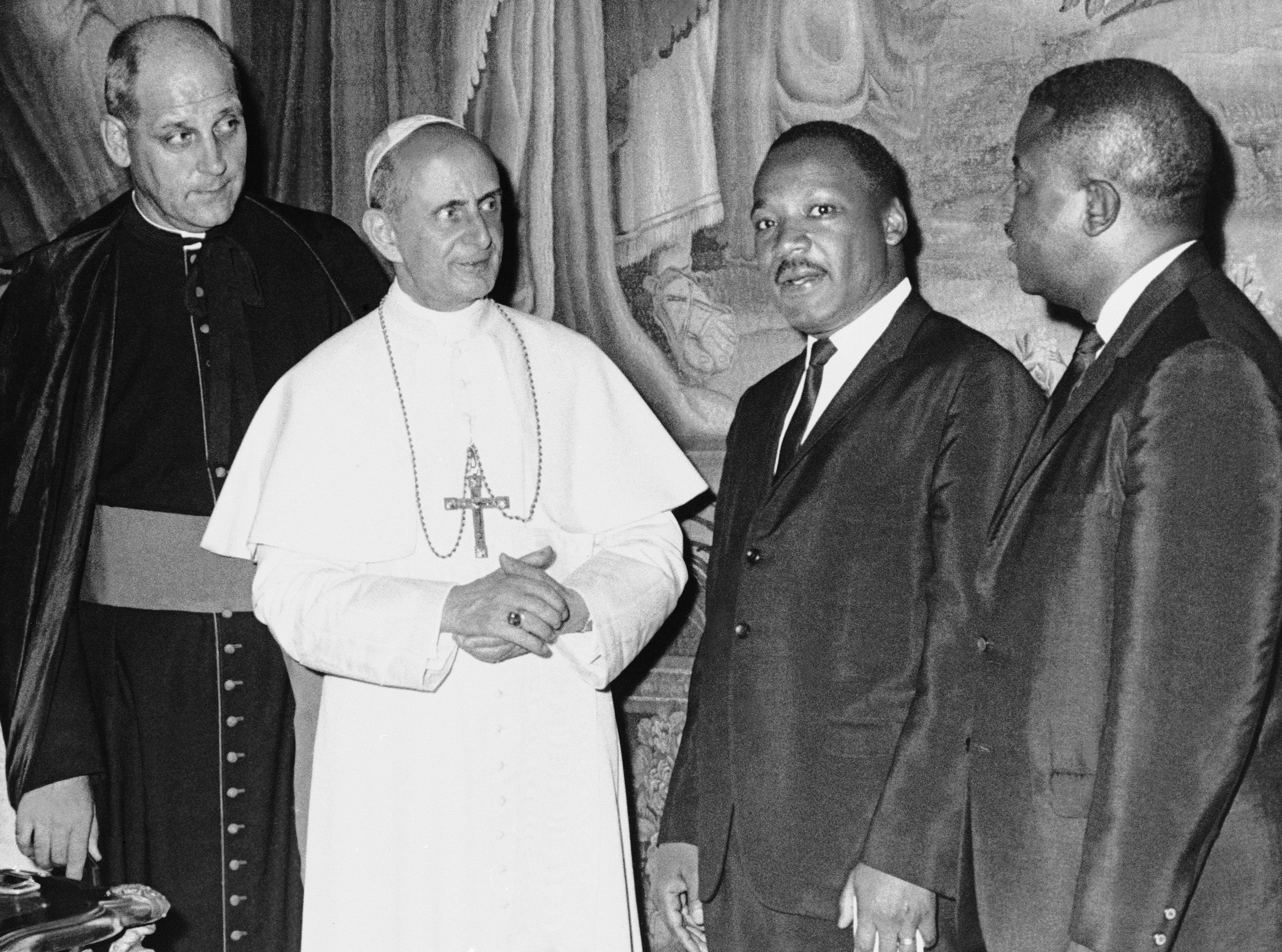 In this photo released by the Vatican, Pope Paul VI poses at the Vatican with American civil rights leader Dr. Martin Luther King, Jr., during a private audience, Sept. 18, 1964. With the pontiff and King are Msgr. Paolo Marcinkus of Chicago, who acted as interpreter, and with King is his aide, Dr. Ralph Abernathy, right. (AP Photo / Vatican Photo)