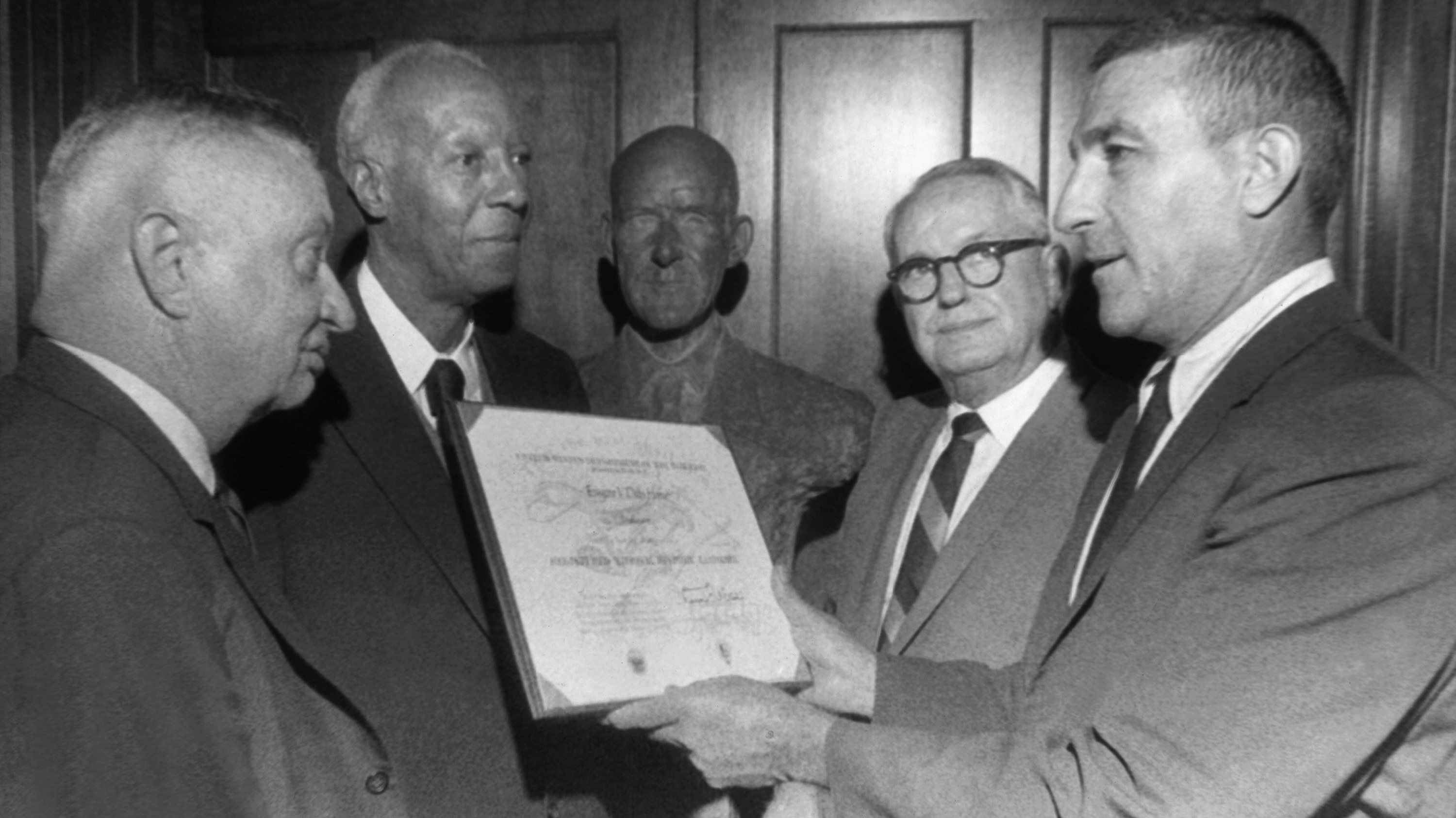 Udall, right, presents the proclamation to, from left, Ned Bush; A. Philip Randolph, President of the Brotherhood of Sleeping Car Porters and Debs Foundation President Patrick Gorman.<br />(AP Photo / Tribune Star)