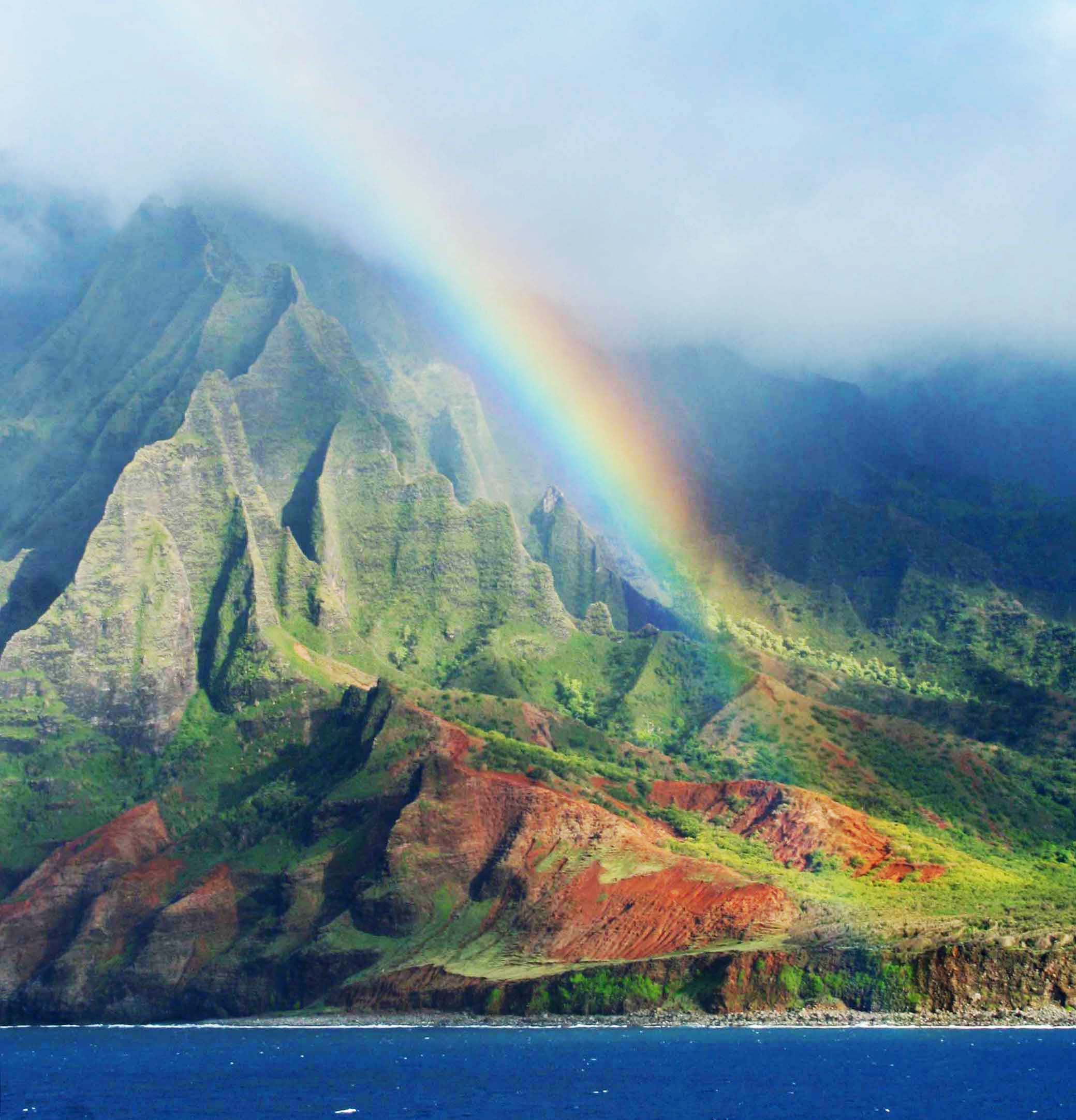 A rainbow is seen over the mountains off the coast of the Big Island of Hawaii. (GPA Photo Archive)