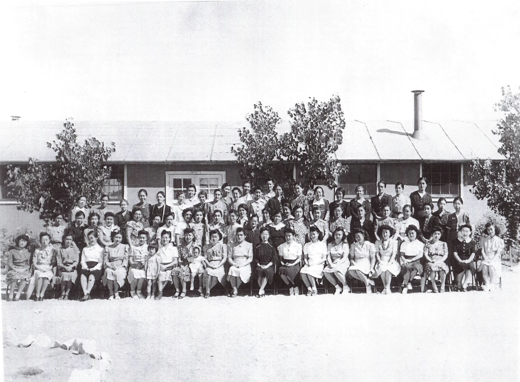 Women and children photographed at one of the many Amache Relocation Center barracks at Granada, Colorado. The government forced Japanese-American families to live in the camp after Japan&#039;s Dec. 7, 1941, attack at Pearl Harbor, Hawaii. Annie Takamatsu (far right, front row) is the mother of Sharon Bartlett of Chadron.<br /> (Photo courtesy of Sharon Bartlett)