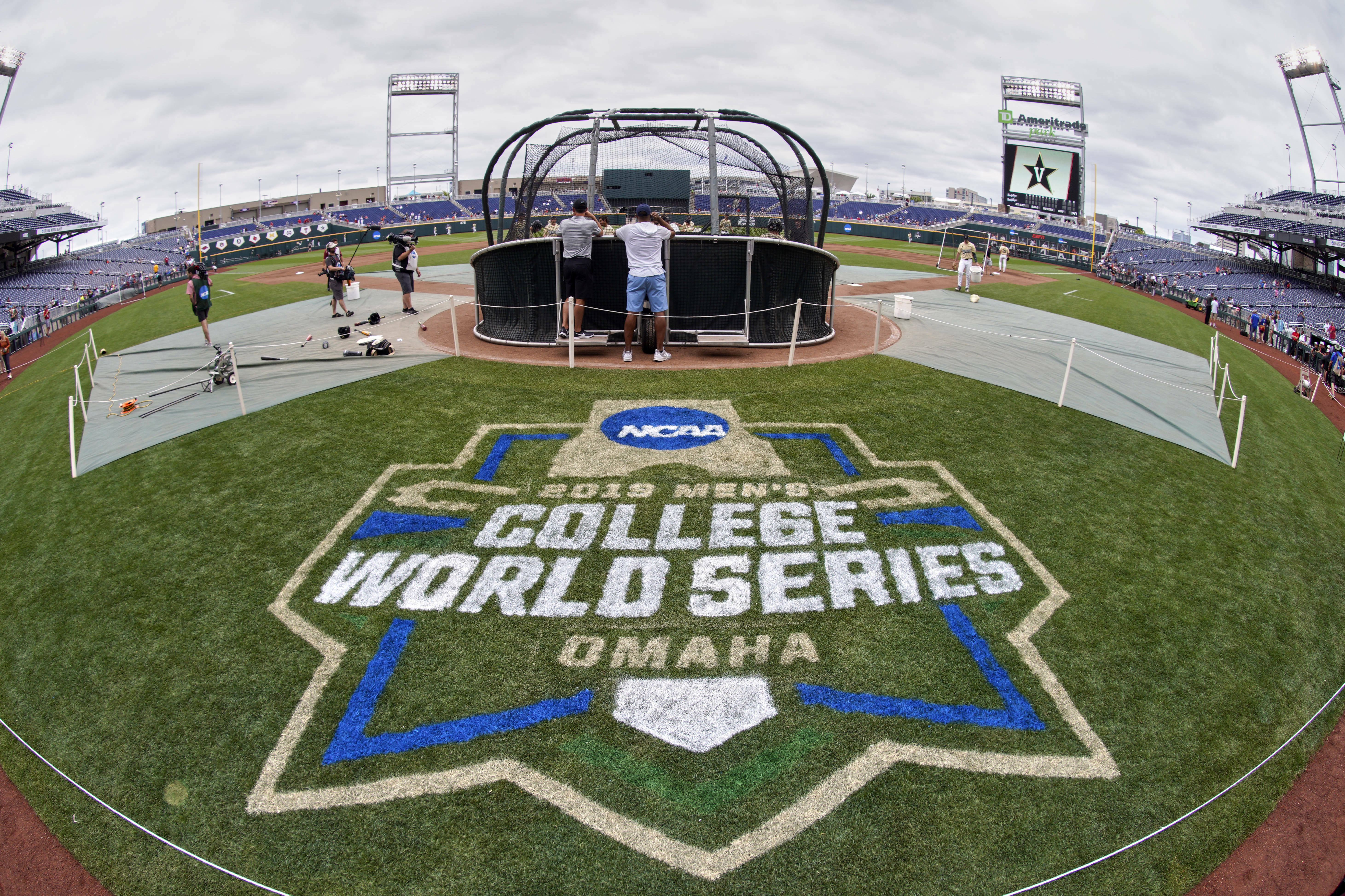 The College World Series logo is partially painted at TD Ameritrade Park in Omaha as Vanderbilt players practice ahead of their College World Series game against Louisville, June 14, 2019. (AP)