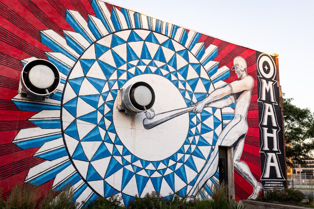 Justin Queal’s mural off on the northwest corner of 17th and Cuming streets celebrating Omaha’s baseball culture. The city has hosted the College World Series since 1950.<br />(Joseph Saaid / Flatwater Free Press)