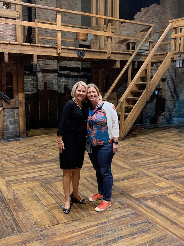 Andrea Bashara, left, a former assistant dean at the Creighton University School of Law and now an associate director in the Creighton Business Office, meets with Bell on stage at the Orpheum Theater in Omaha. (Courtesy Creighton University)