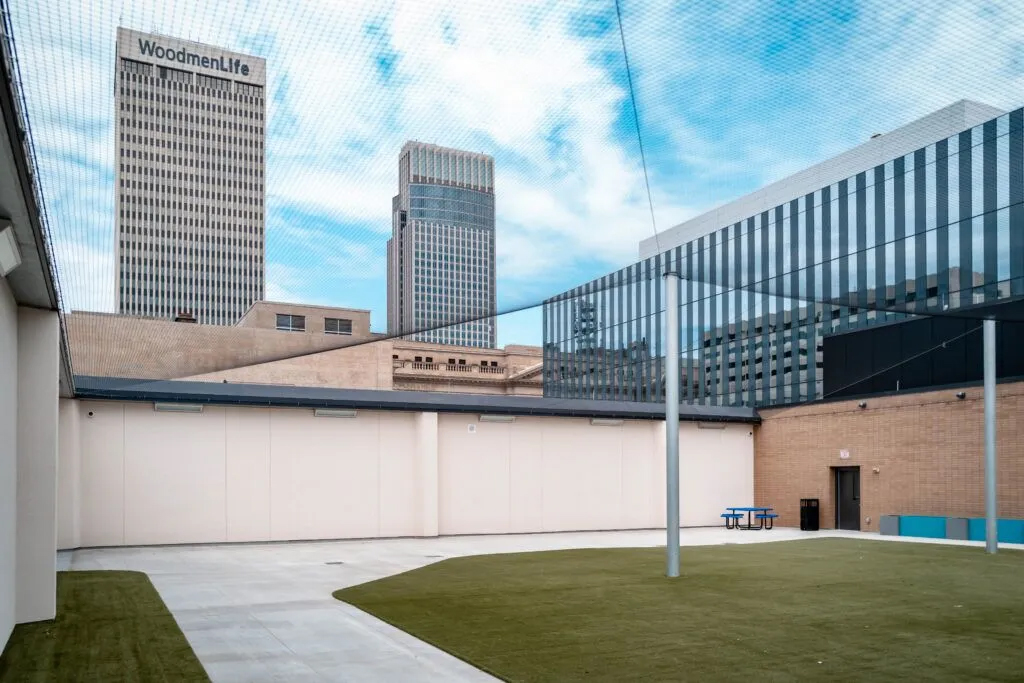 The new Douglas County Youth and Family Support Center has a rooftop recreation area with a patch of turf in the middle. The area could eventually include ping-pong tables and cornhole sets if kids arrive at the facility.<br />(Abiola Kosoko / Flatwater Free Press)