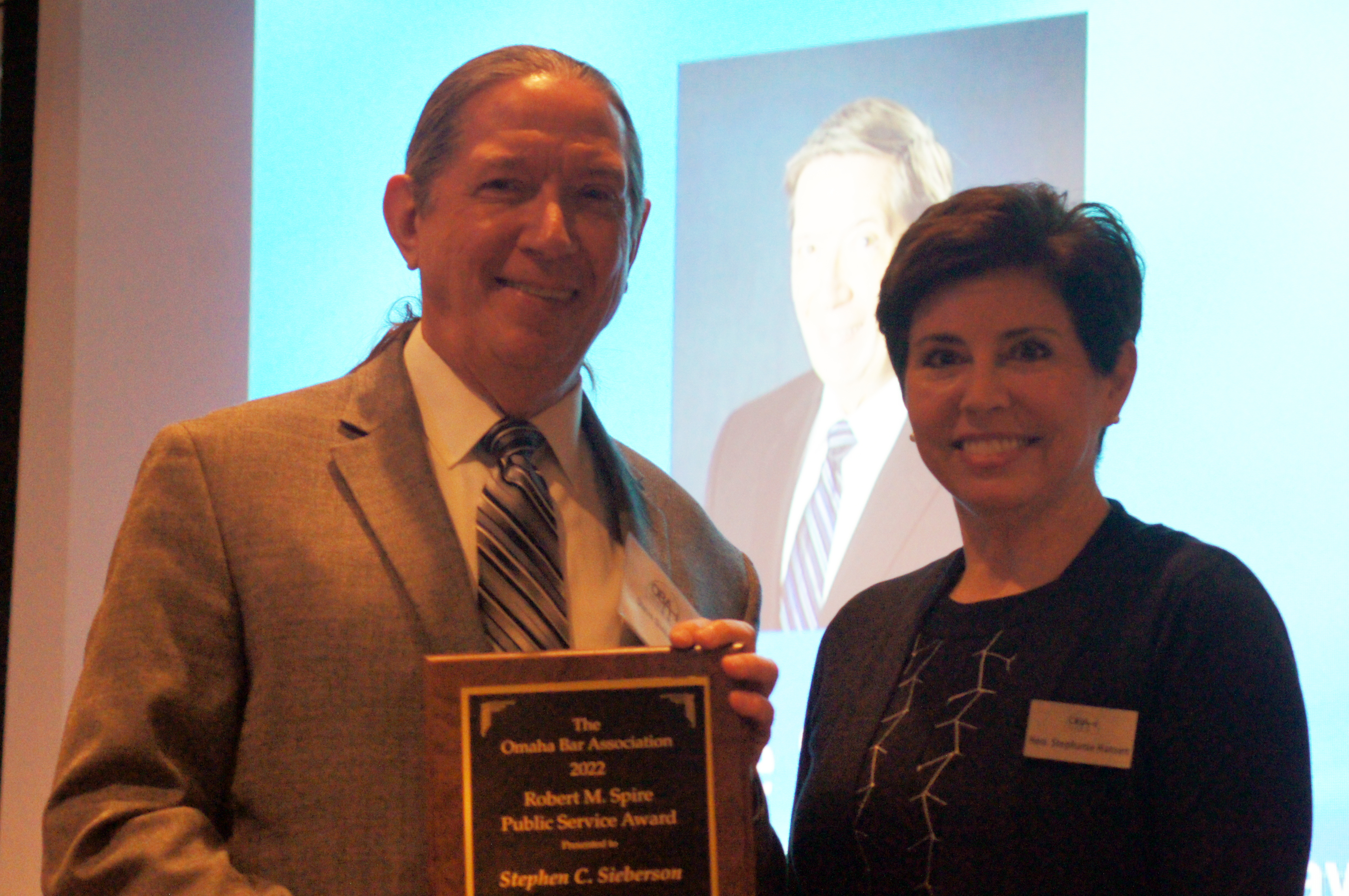 Stephen Sieberson receiving the OBA Robert M. Spire Public Service Award from Hon. Stephanie R. Hansen May 2, 2022 at the Law Day Luncheon. (Jason Huff / The Daily Record)