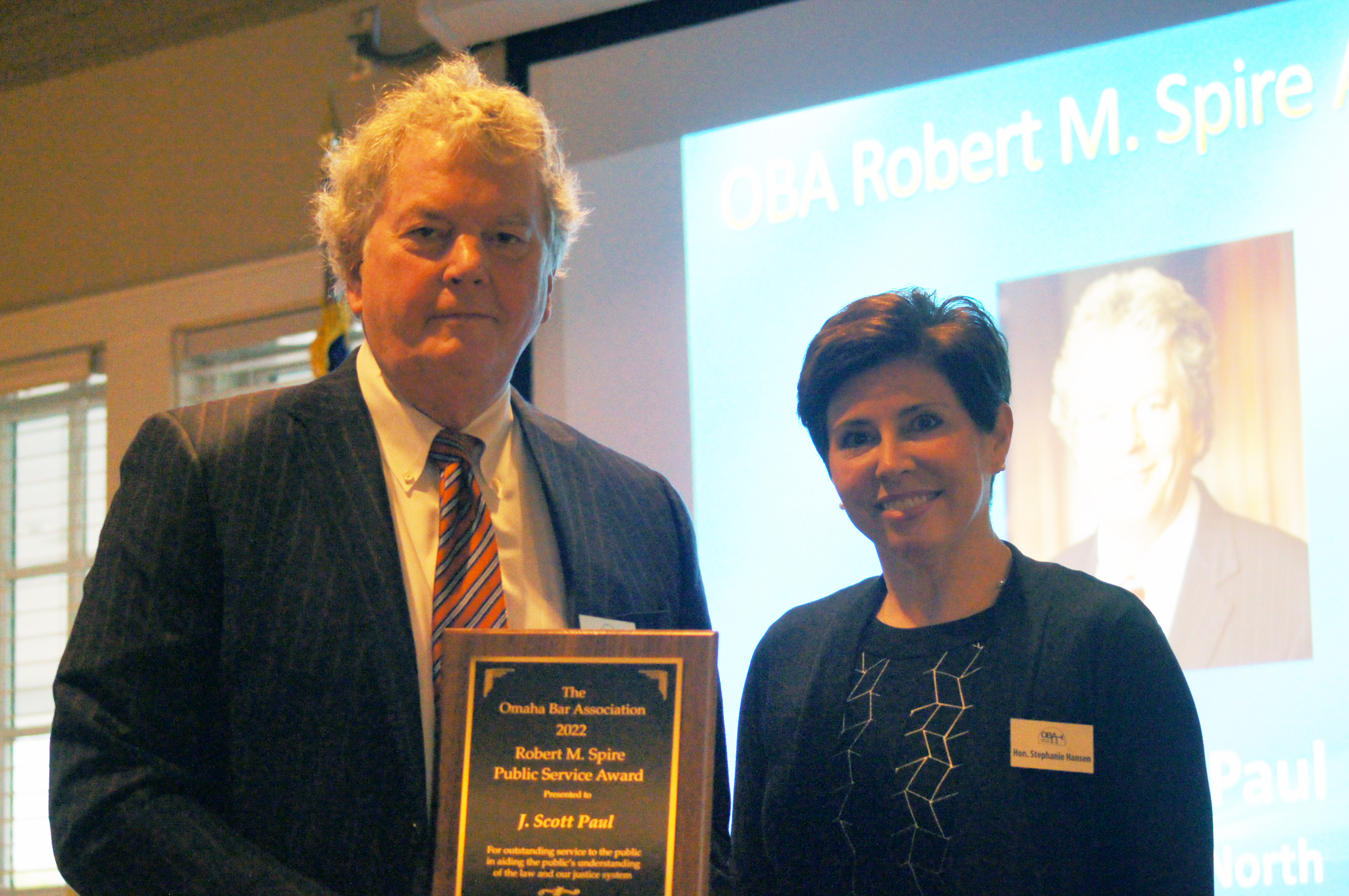 J. Scott Paul receiving the OBA Robert M. Spire Public Service Award from Hon. Stephanie R. Hansen May 2, 2022 at the Law Day Luncheon. (Jason Huff / The Daily Record)