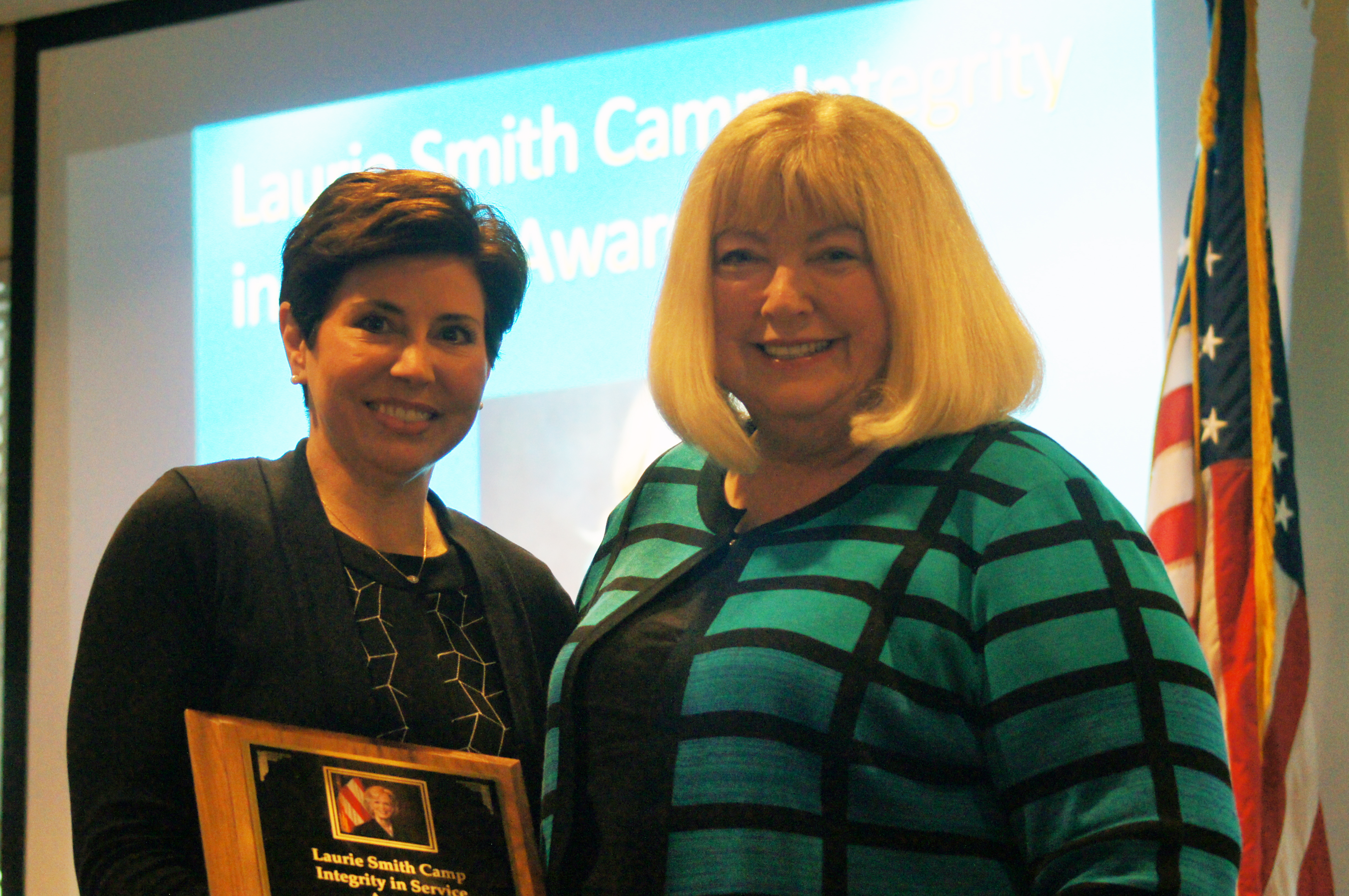 Deb Gilg accepting her award from Hon. Stephanie R. Hansen May 2, 2022. (Jason Huff / The Daily Record)