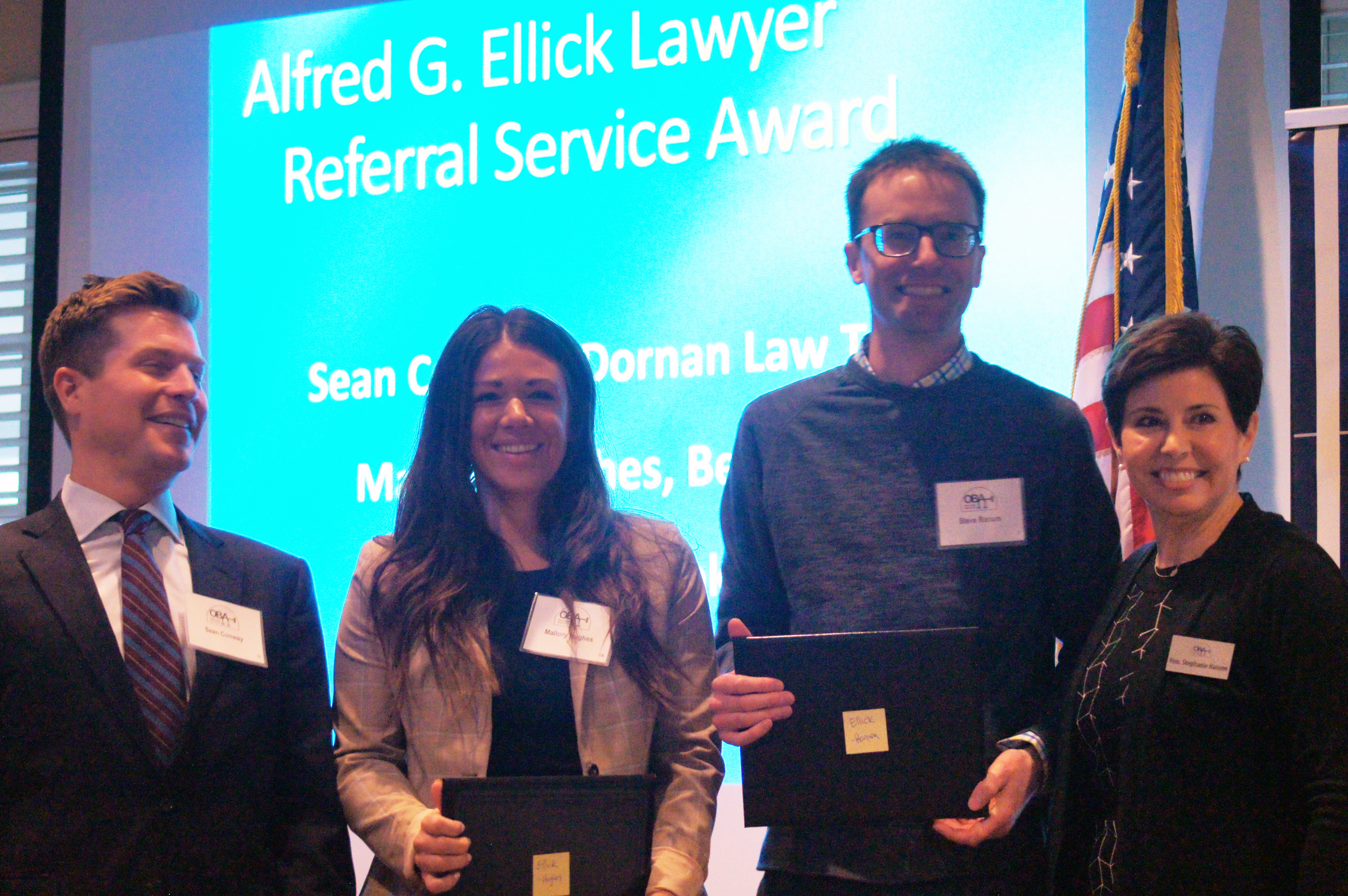 From Left to Right: Sean Conway, Mallory Hughes, Steven G. Ranum, and 2022 OBA President Hon. Stephanie R. Hansen at the Law Day Luncheon May 2, 2022. (Jason Huff / The Daily Record)