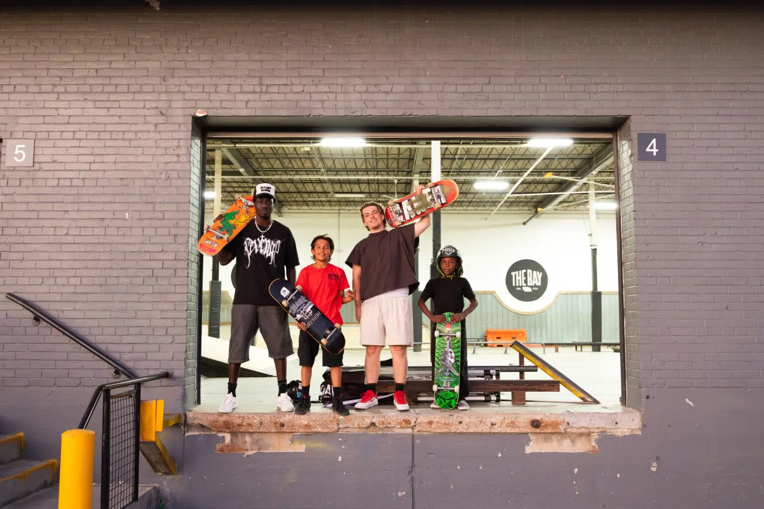 From left: Wolow Gatluak, Carmelo, Treyson Russell and Boogie at The Bay in Lincoln on June 29, 2024. Gatluak and Russell have built a massive online following with their videos, mostly of them and their friends skating.<br />(Naomi Delkamiller / Flatwater Free Press)