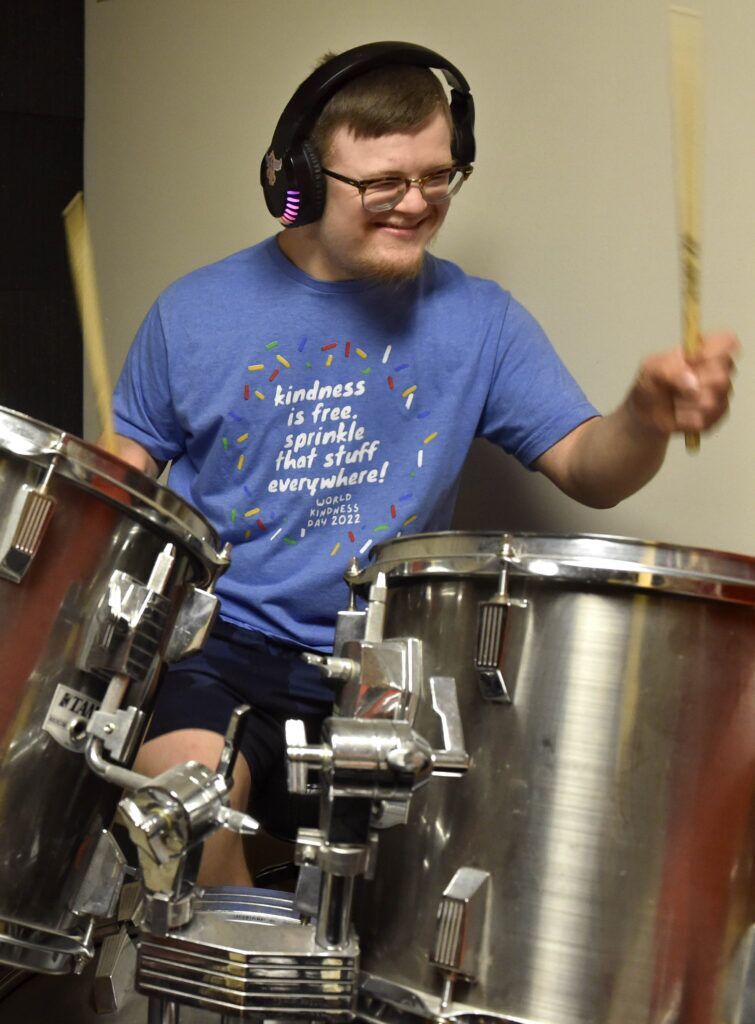 Jack Baker practices the drums in a music room at Live Yes Studios in Lincoln on June 11, 2024.<br />(Eric Gregory / Flatwater Free Press)