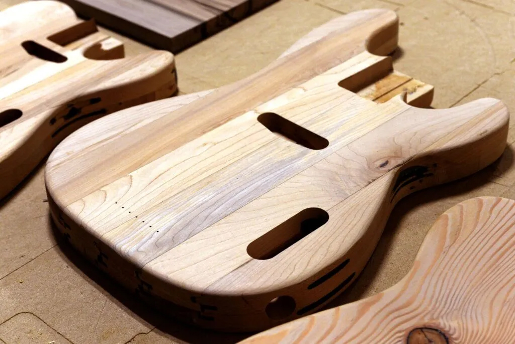 A Stratocaster-style guitar body formed from maple flooring salvaged from the Pershing Auditorium stage.<br />(Eric Gregory / Flatwater Free Press)