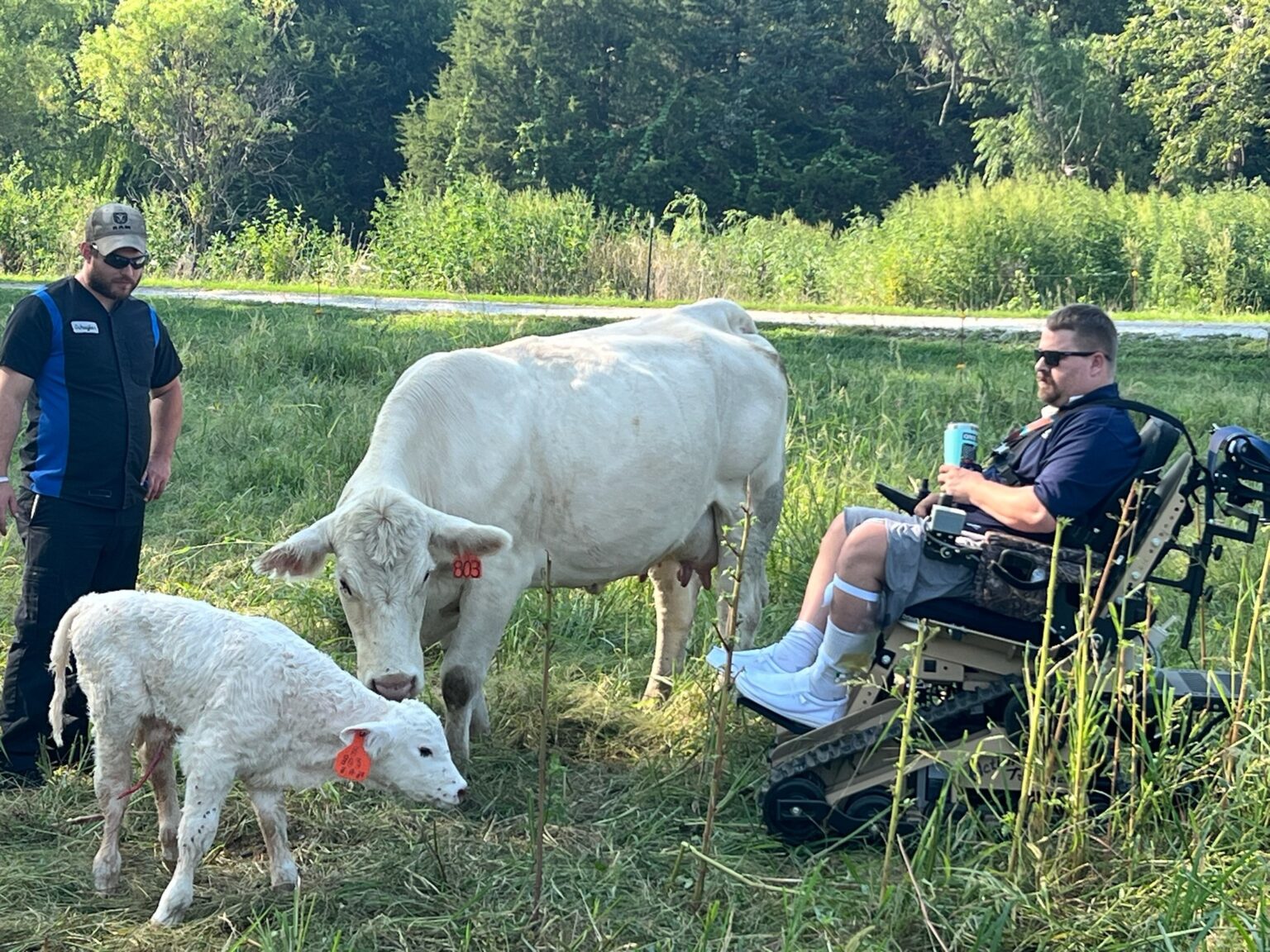 Eric Fass with livestock on his farm just outside Syracuse, Nebraska. The Nebraska AgrAbility program helps connect ag workers who have disabilities and health impediments to resources and agencies that can provide modified equipment to help keep them farming. Fass’ neighbors and community also held fundraisers and bought him a motorized wheelchair.<br />(Courtesy of Fass family)